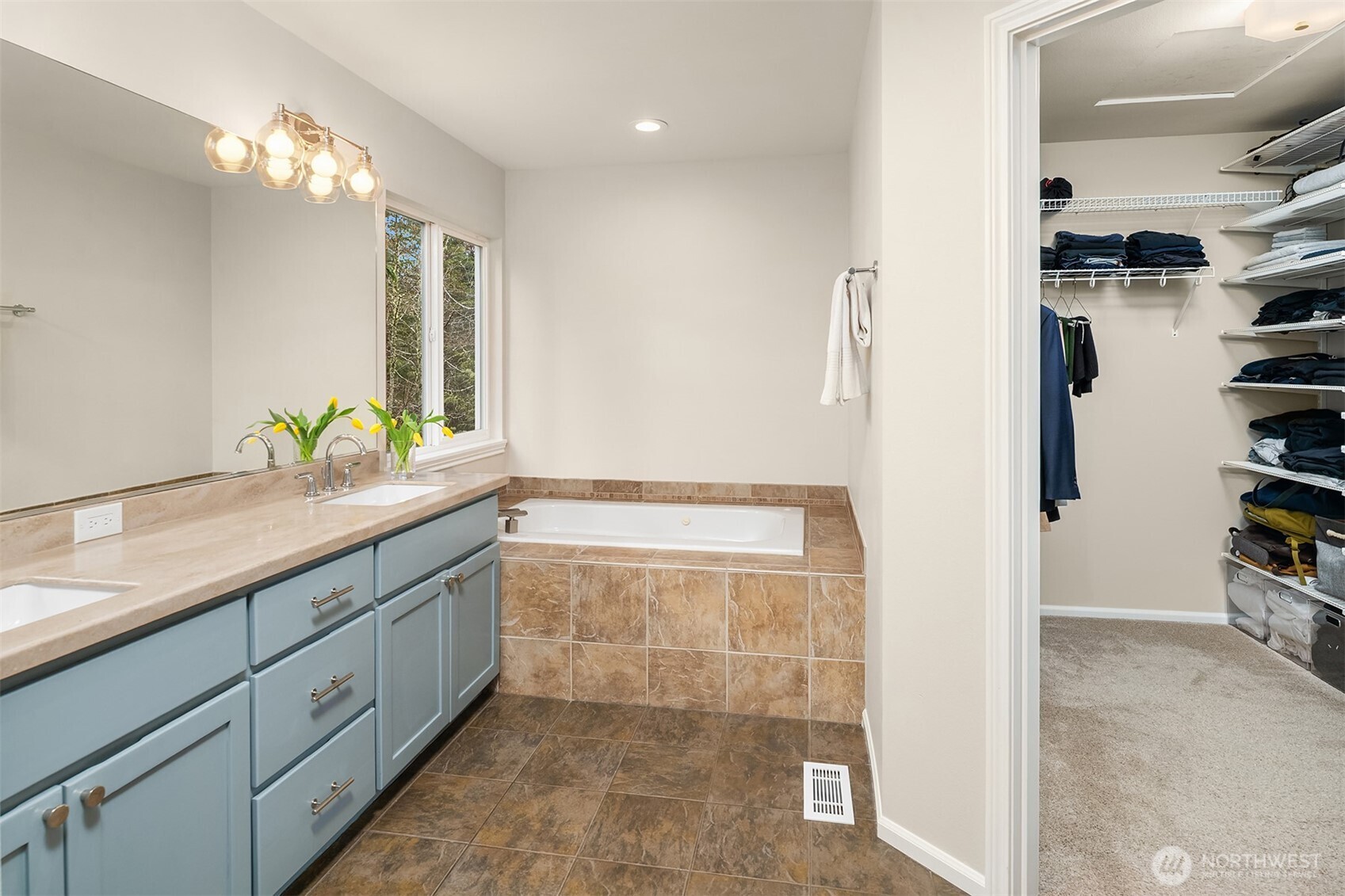 47419 Southeast 157th Place North Bend, WA 98045 - Photo 27 of 39 a bathroom with a granite countertop sink a large mirror and a shower