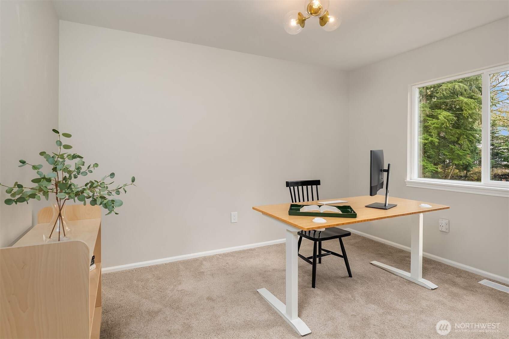 47419 Southeast 157th Place North Bend, WA 98045 - Photo 33 of 39 a view of a workspace with a table and a potted plant
