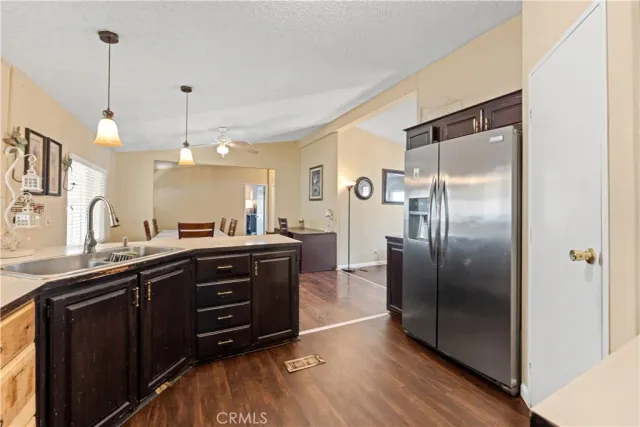 a kitchen with a refrigerator and a sink