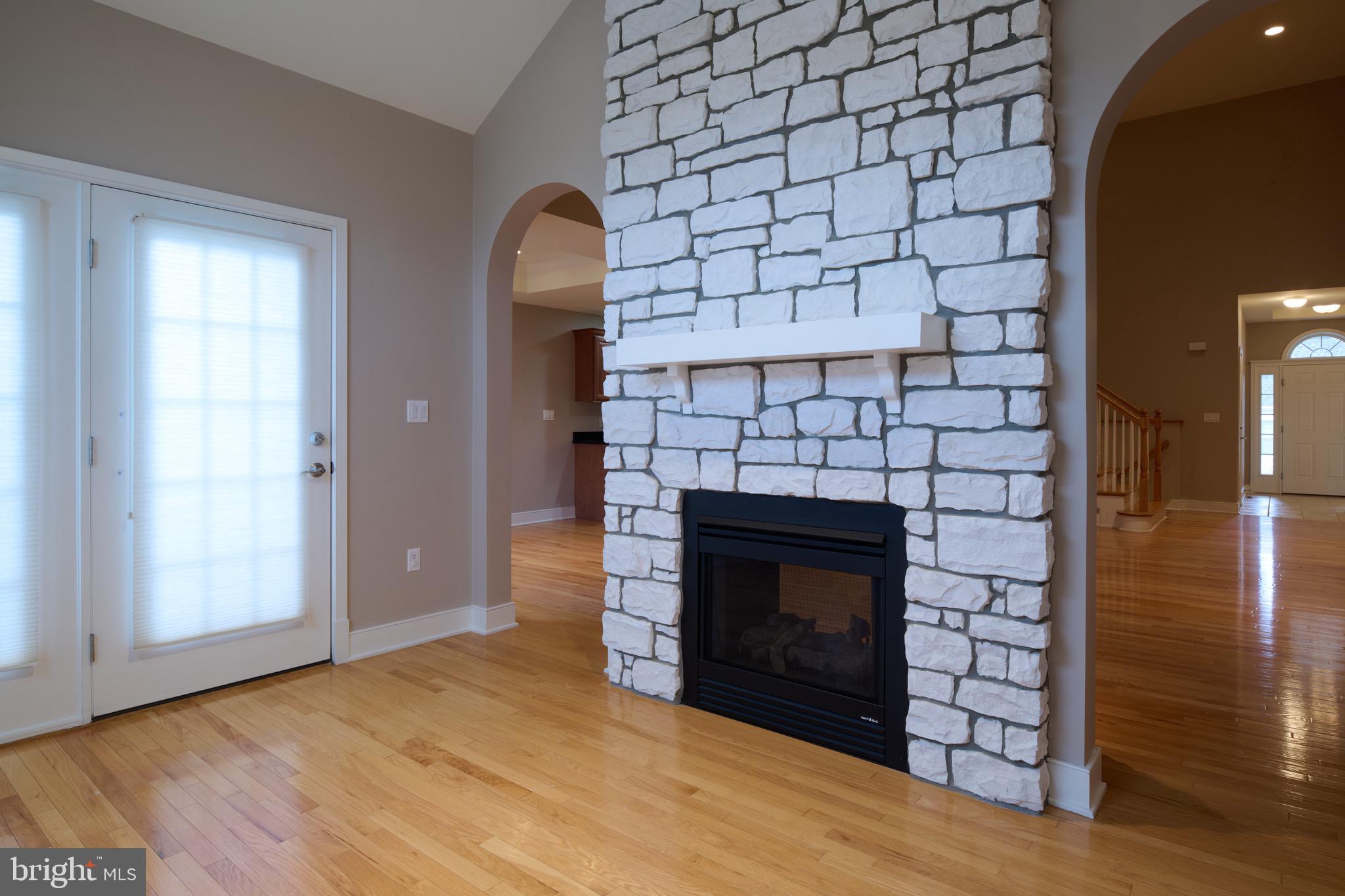 3222 Shellers Bend, Unit 209 State College, PA 16801 - Photo 14 of 76 Sunroom with gas fireplace and door to patio