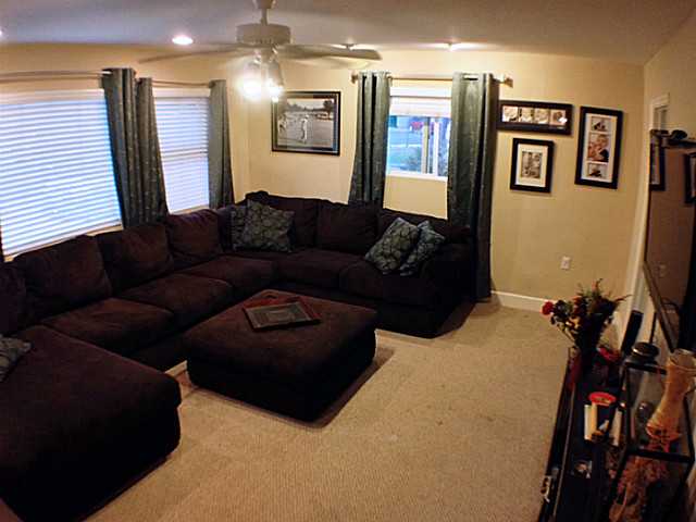 9743 Vomac Road Santee, CA 92071 - Photo 7 of 21 Awesome very large family room with lots of window. The perfect spot to relax and hang out with family and friends. This is a really nice room.