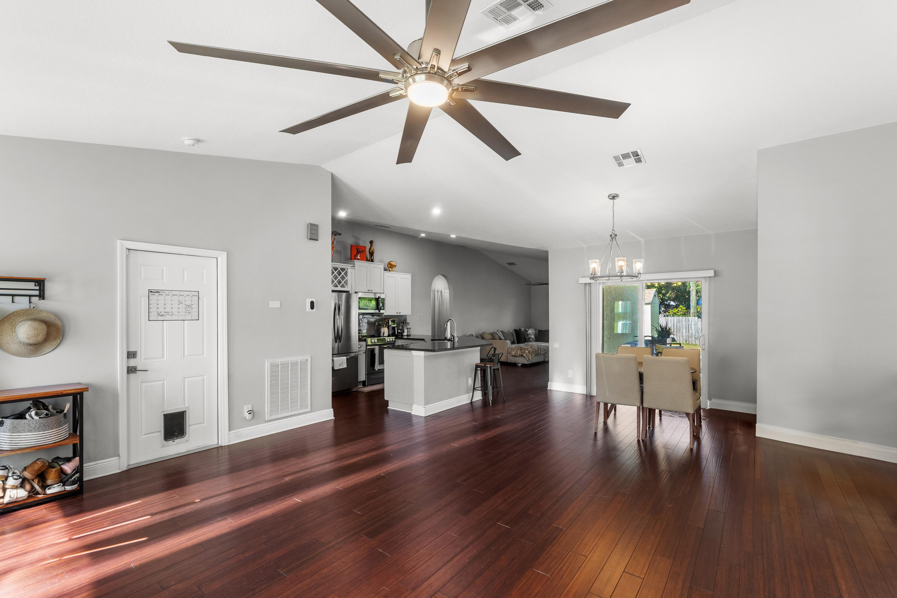 3037 Southeast Iris Street Stuart, FL 34997 - Photo 11 of 36 a living room with furniture and kitchen view