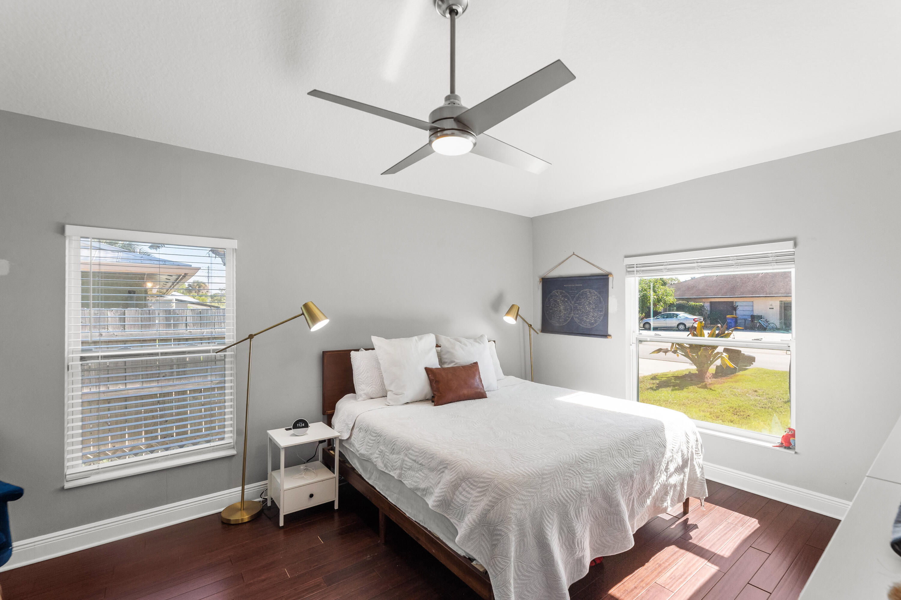 3037 Southeast Iris Street Stuart, FL 34997 - Photo 17 of 36 a bedroom with a bed and a window