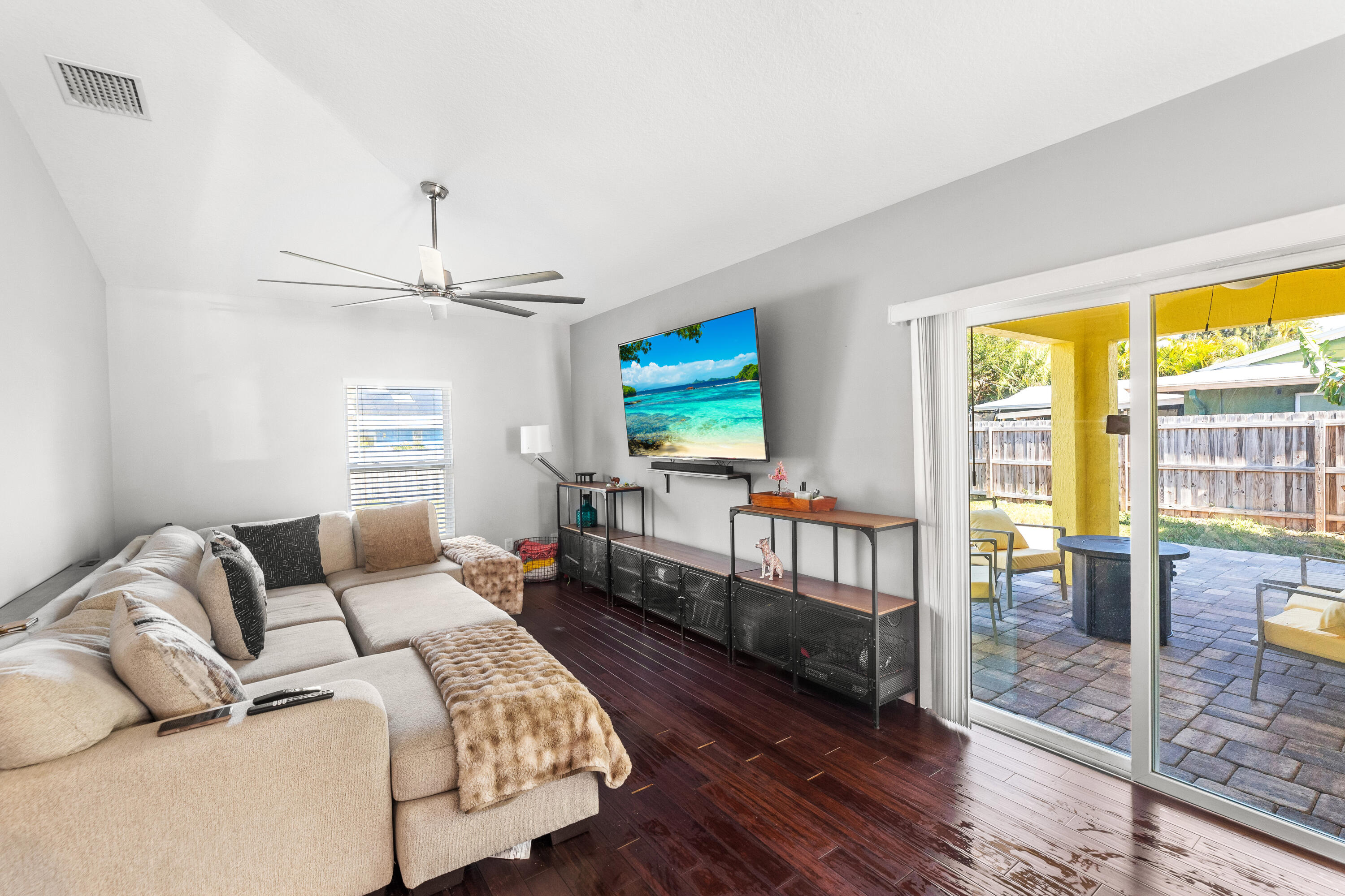 3037 Southeast Iris Street Stuart, FL 34997 - Photo 21 of 36 a living room with furniture and a flat screen tv
