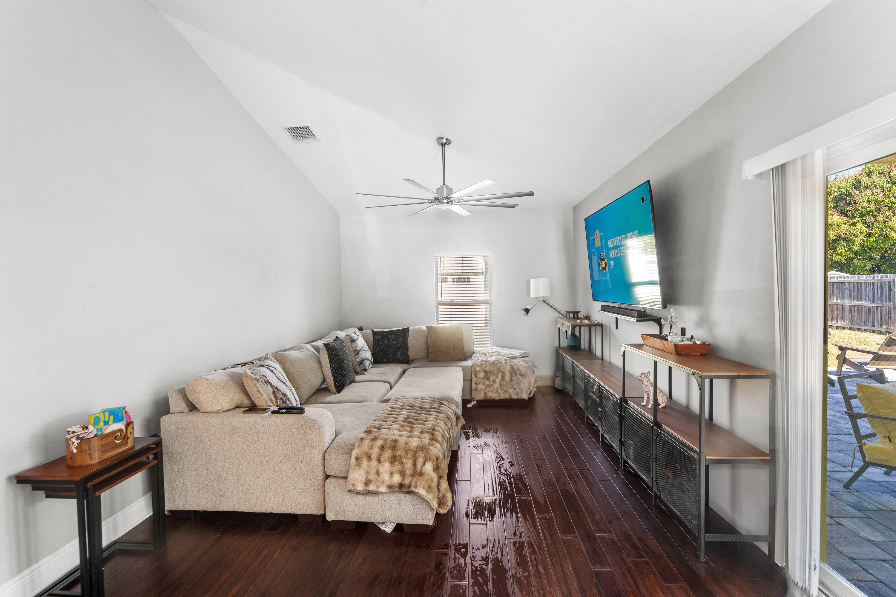 3037 Southeast Iris Street Stuart, FL 34997 - Photo 23 of 36 a living room with furniture and a wooden floor
