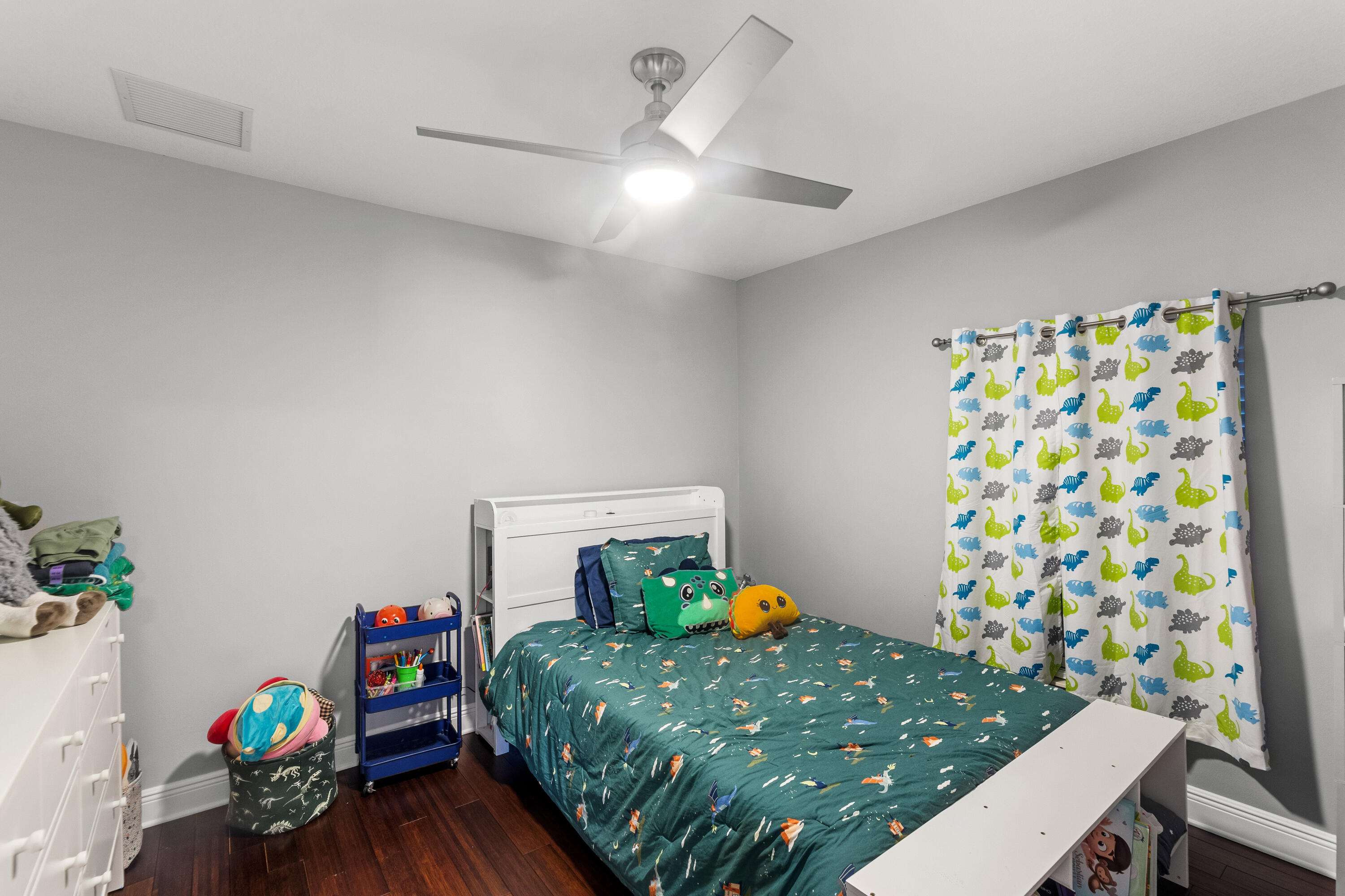 3037 Southeast Iris Street Stuart, FL 34997 - Photo 27 of 36 a room with toys and wooden floor