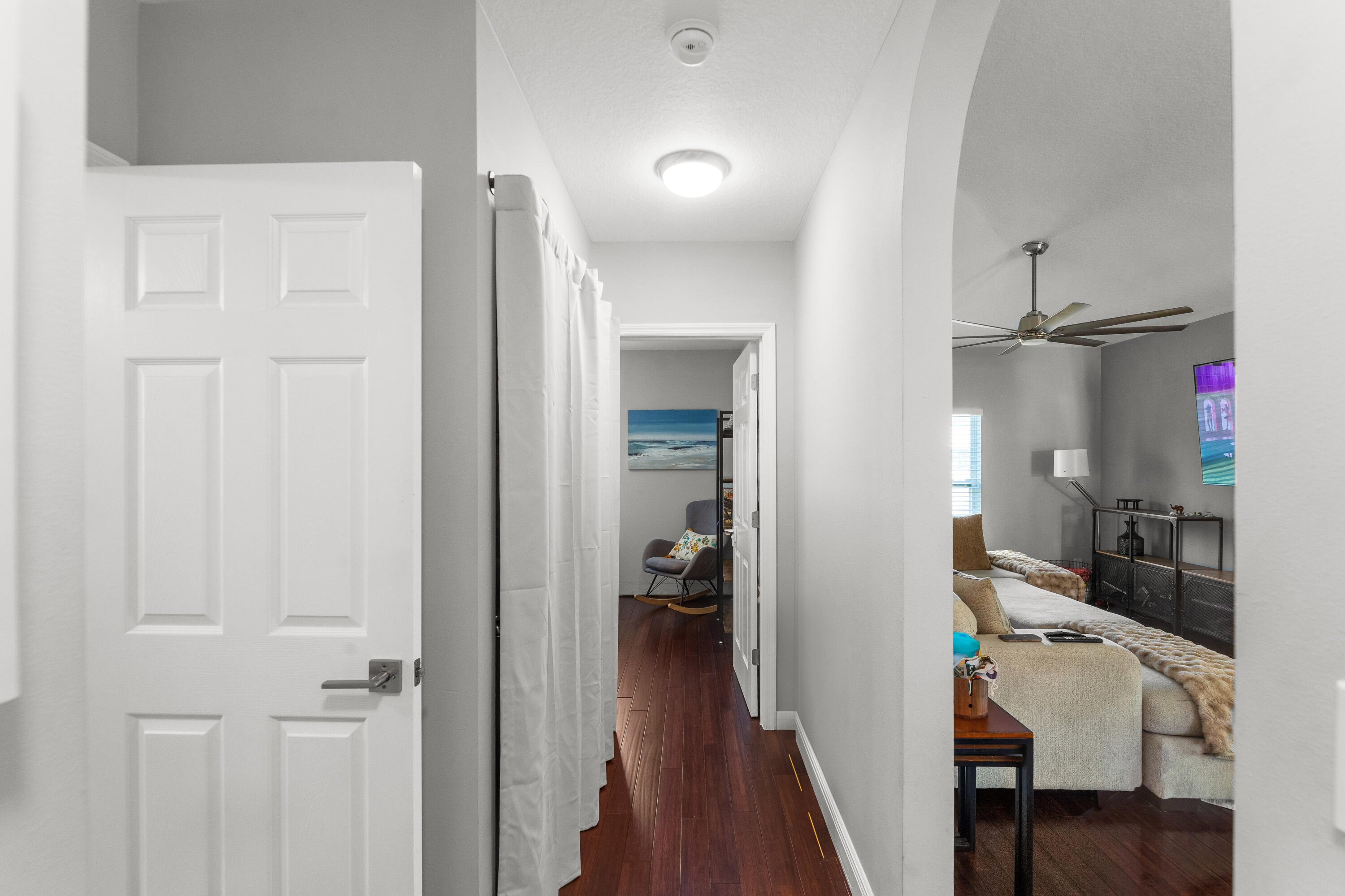 3037 Southeast Iris Street Stuart, FL 34997 - Photo 28 of 36 a view of a hallway and a livingroom with furniture
