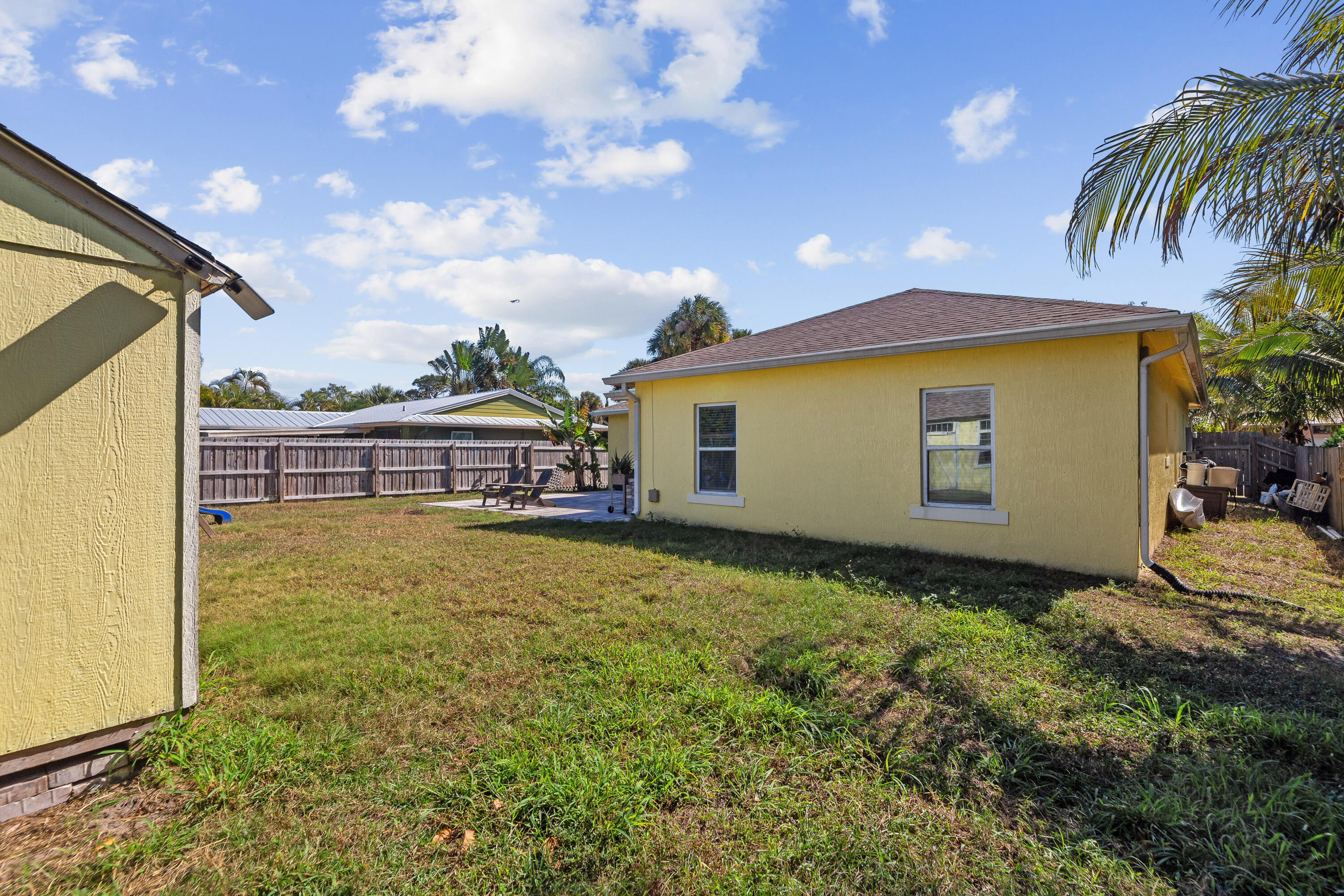3037 Southeast Iris Street Stuart, FL 34997 - Photo 36 of 36 a view of an house with backyard space and balcony