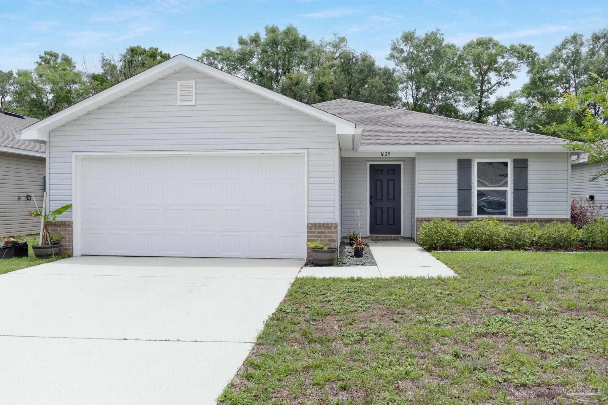 1625 Addies Way Pensacola, FL 32534 - Photo 1 of 50 a front view of house with yard and trees in the background