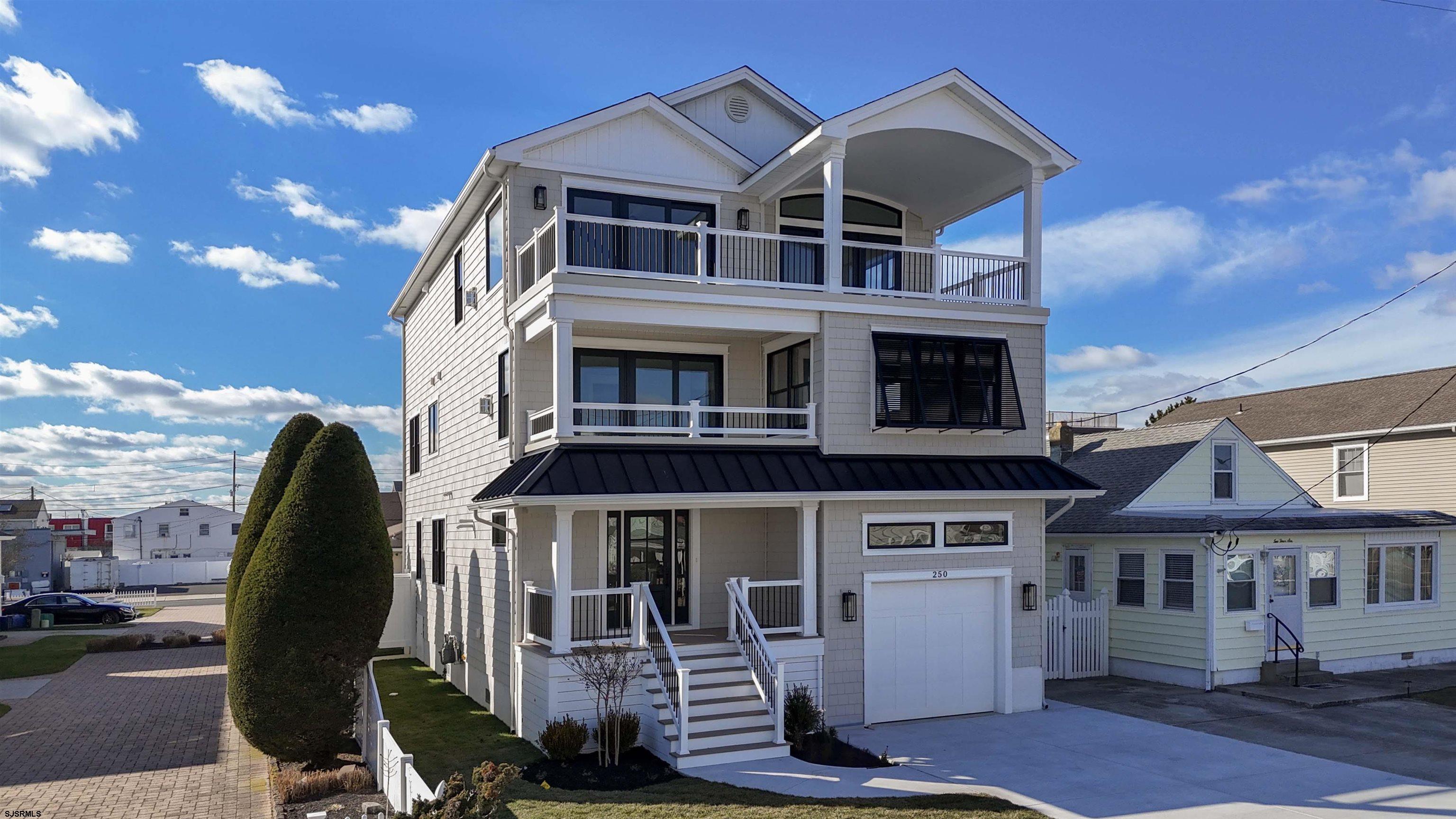 204 12th Street South Brigantine, NJ 08203 - Photo 1 of 63 a front view of a house with a porch