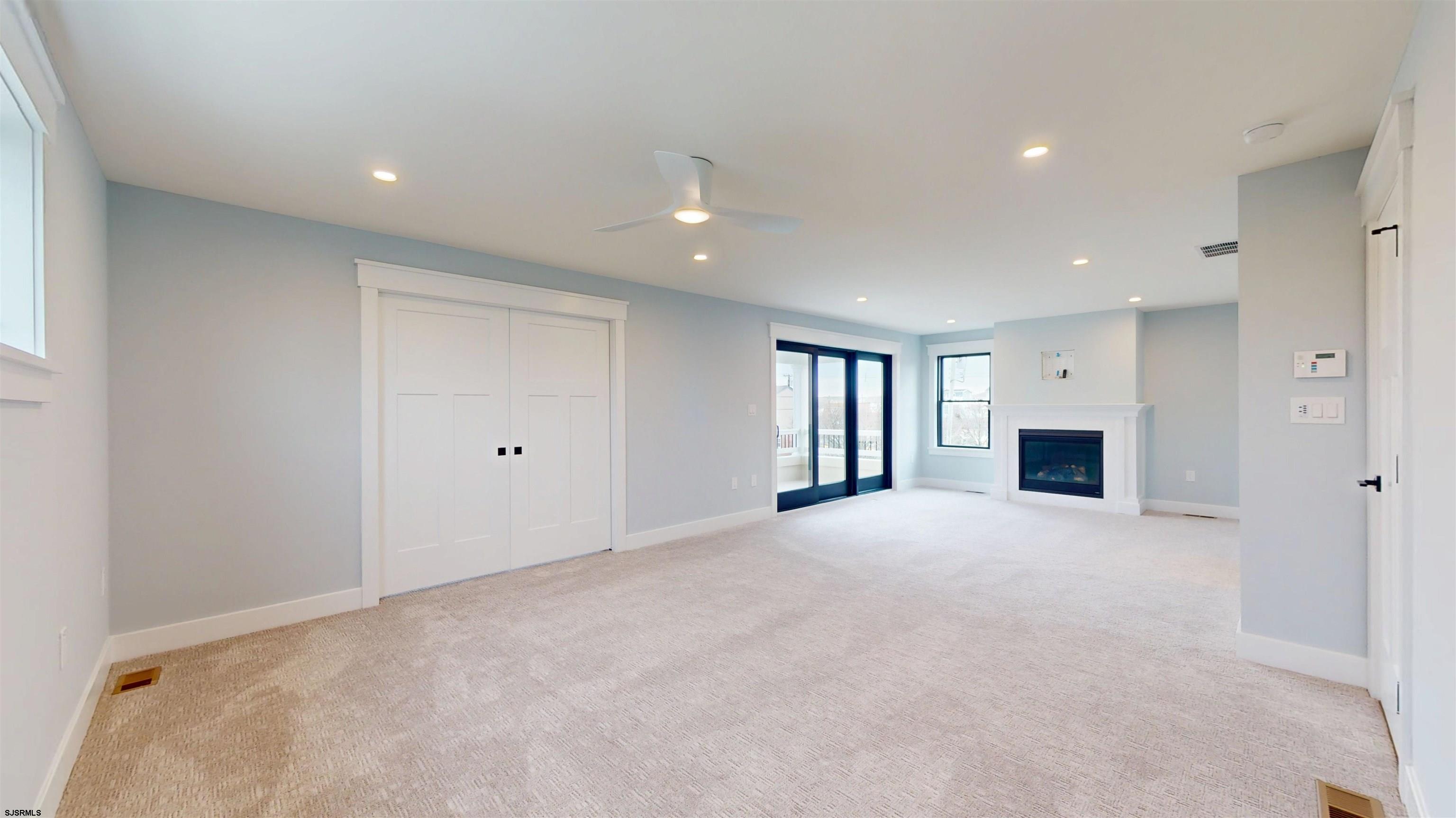 204 12th Street South Brigantine, NJ 08203 - Photo 20 of 63 a view of an empty room with a window and fireplace