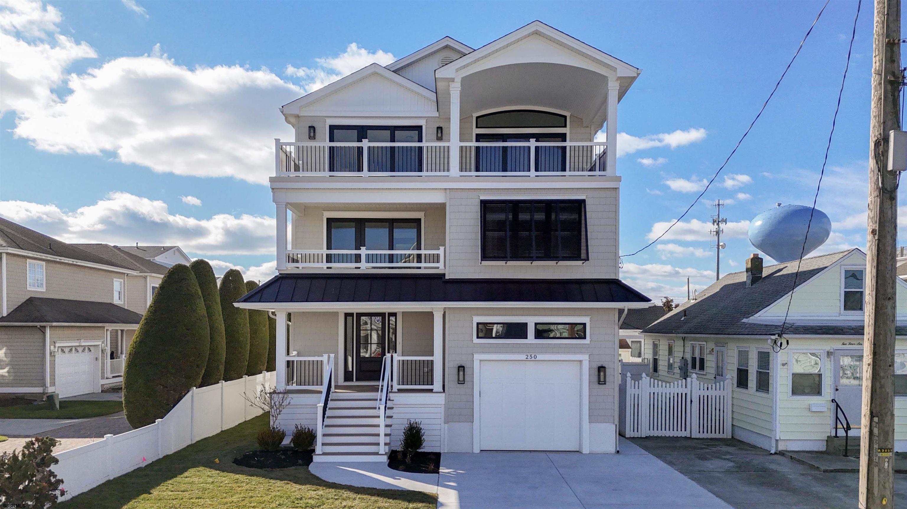 204 12th Street South Brigantine, NJ 08203 - Photo 2 of 63 a front view of a house with a yard