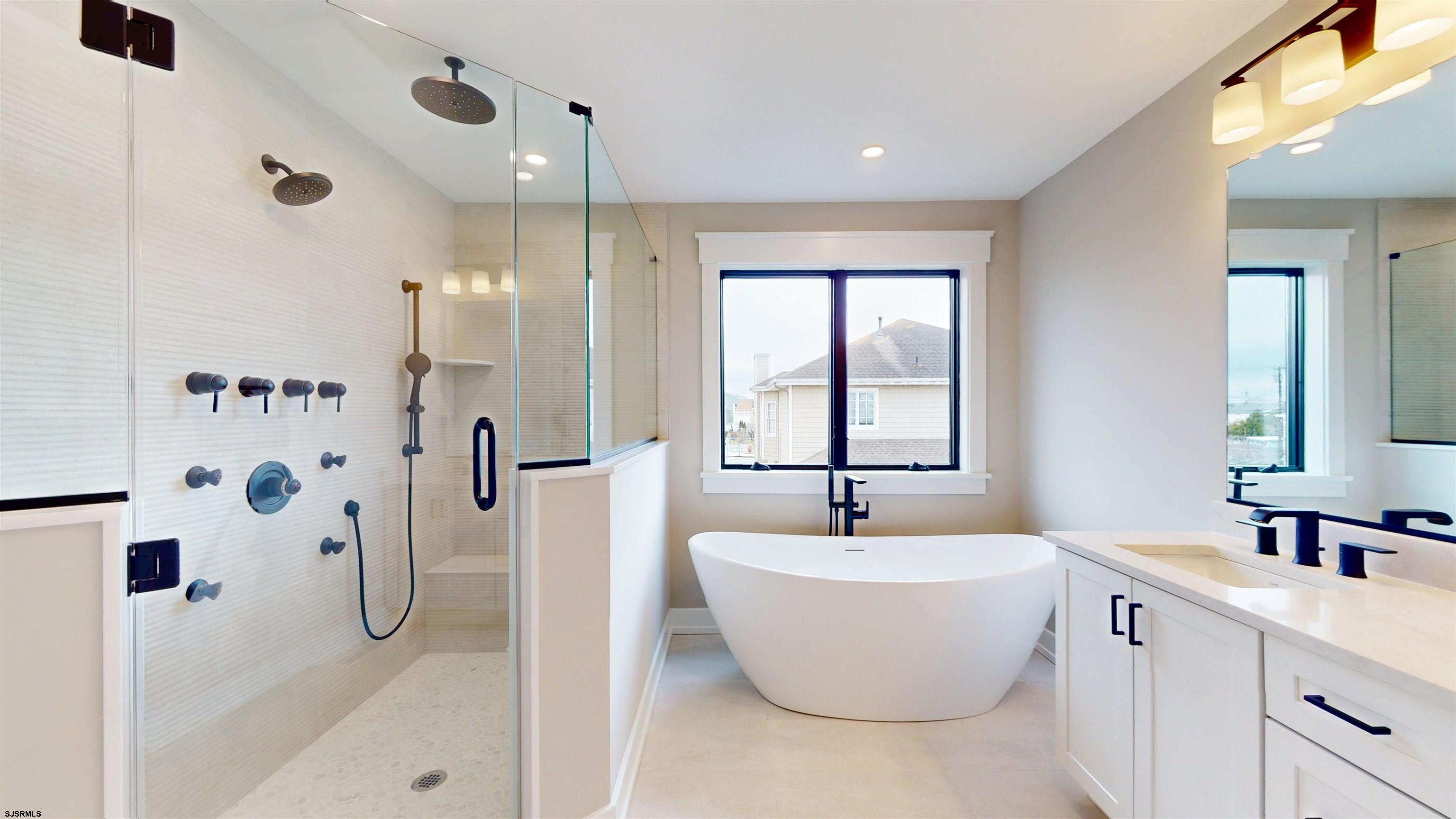 204 12th Street South Brigantine, NJ 08203 - Photo 27 of 63 a bathroom with a bathtub and shower