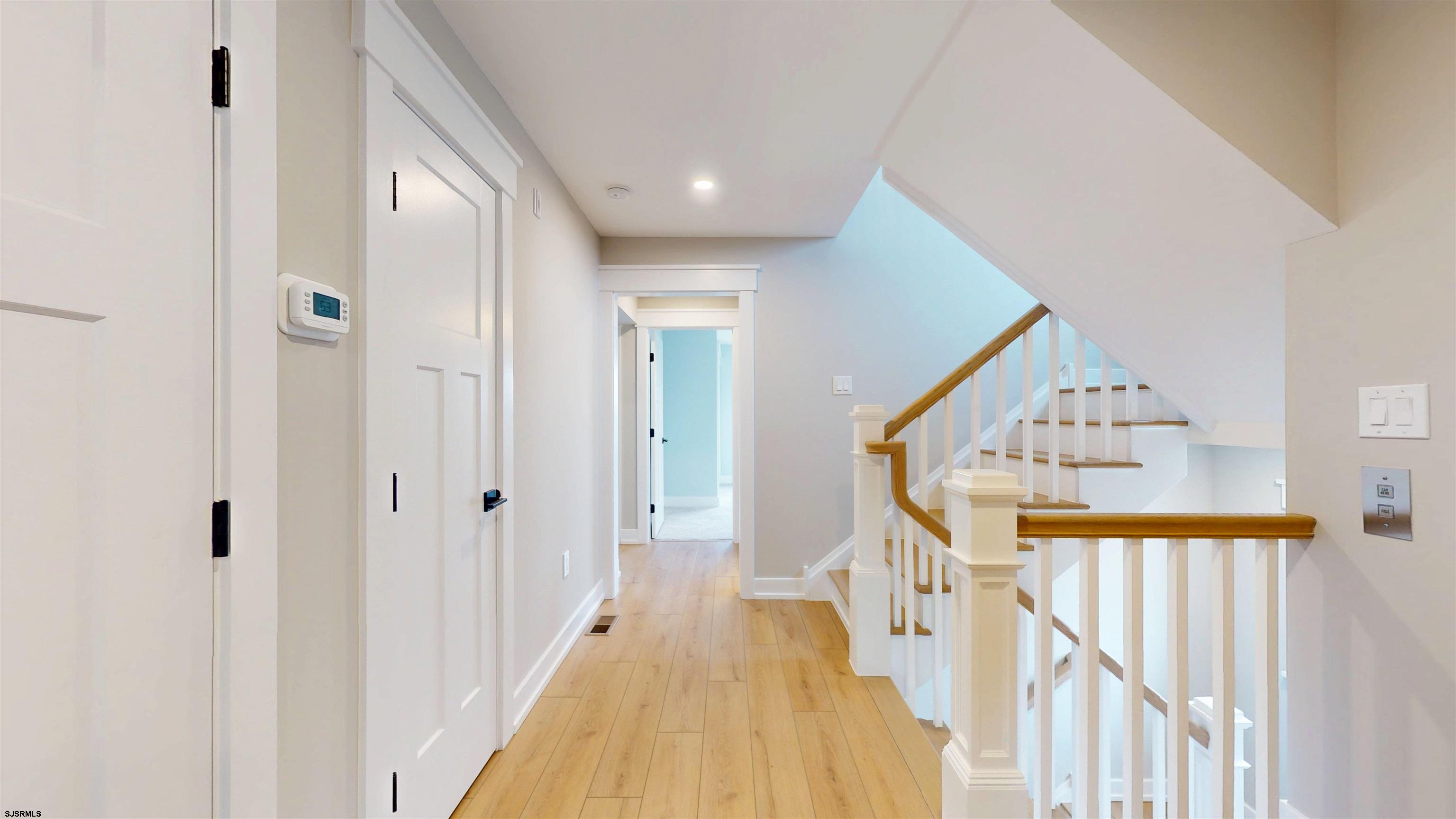 204 12th Street South Brigantine, NJ 08203 - Photo 31 of 63 a view of a hallway with wooden floor and entryway