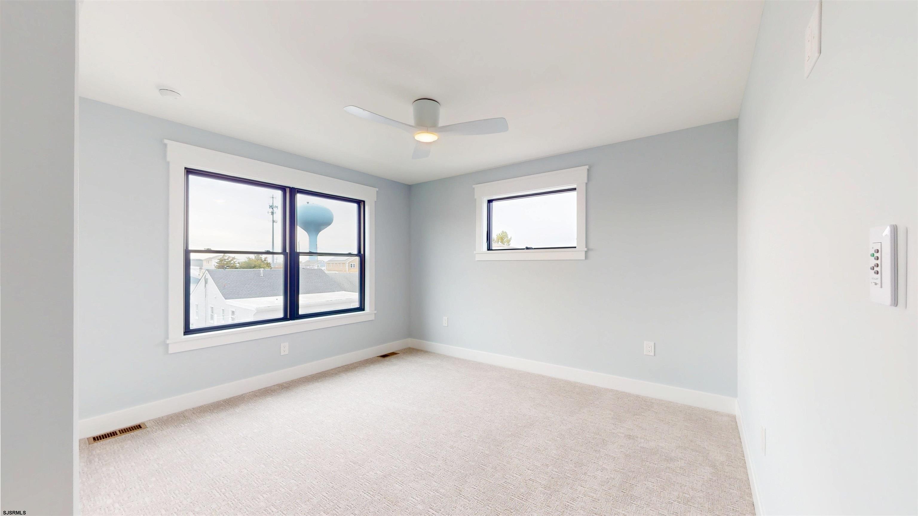 204 12th Street South Brigantine, NJ 08203 - Photo 41 of 63 an empty room with windows and closet