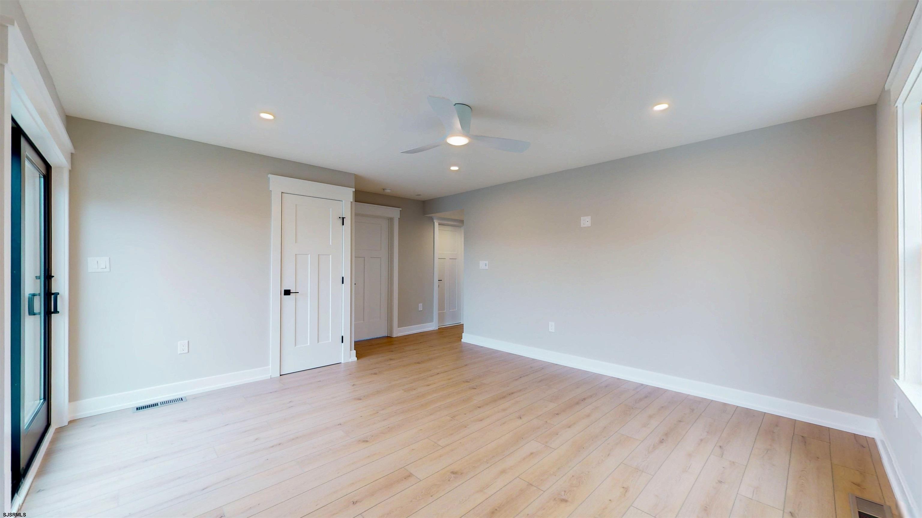 204 12th Street South Brigantine, NJ 08203 - Photo 43 of 63 a view of an empty room with wooden floor