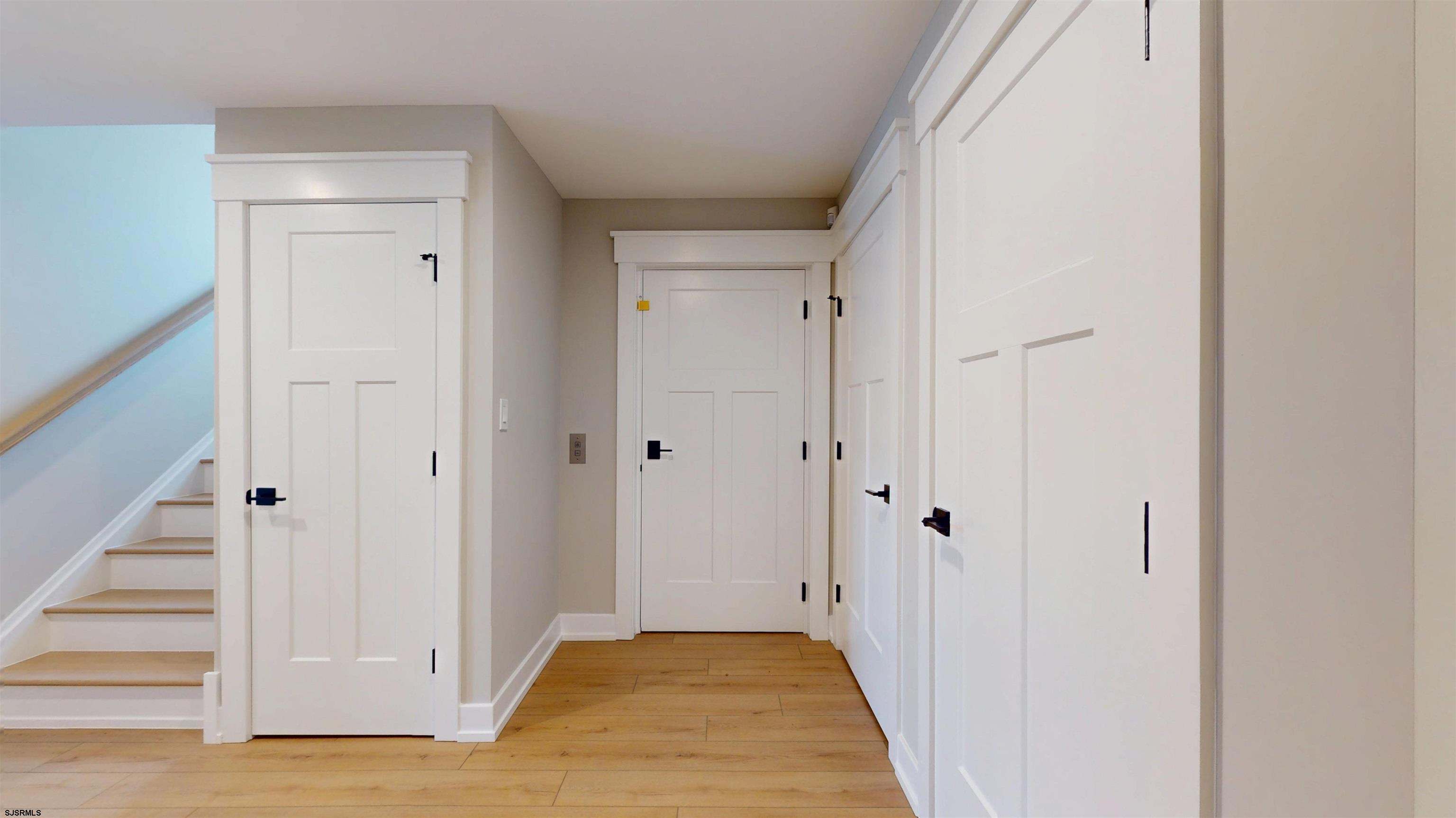204 12th Street South Brigantine, NJ 08203 - Photo 49 of 63 a view of a hallway with wooden floor and entryway