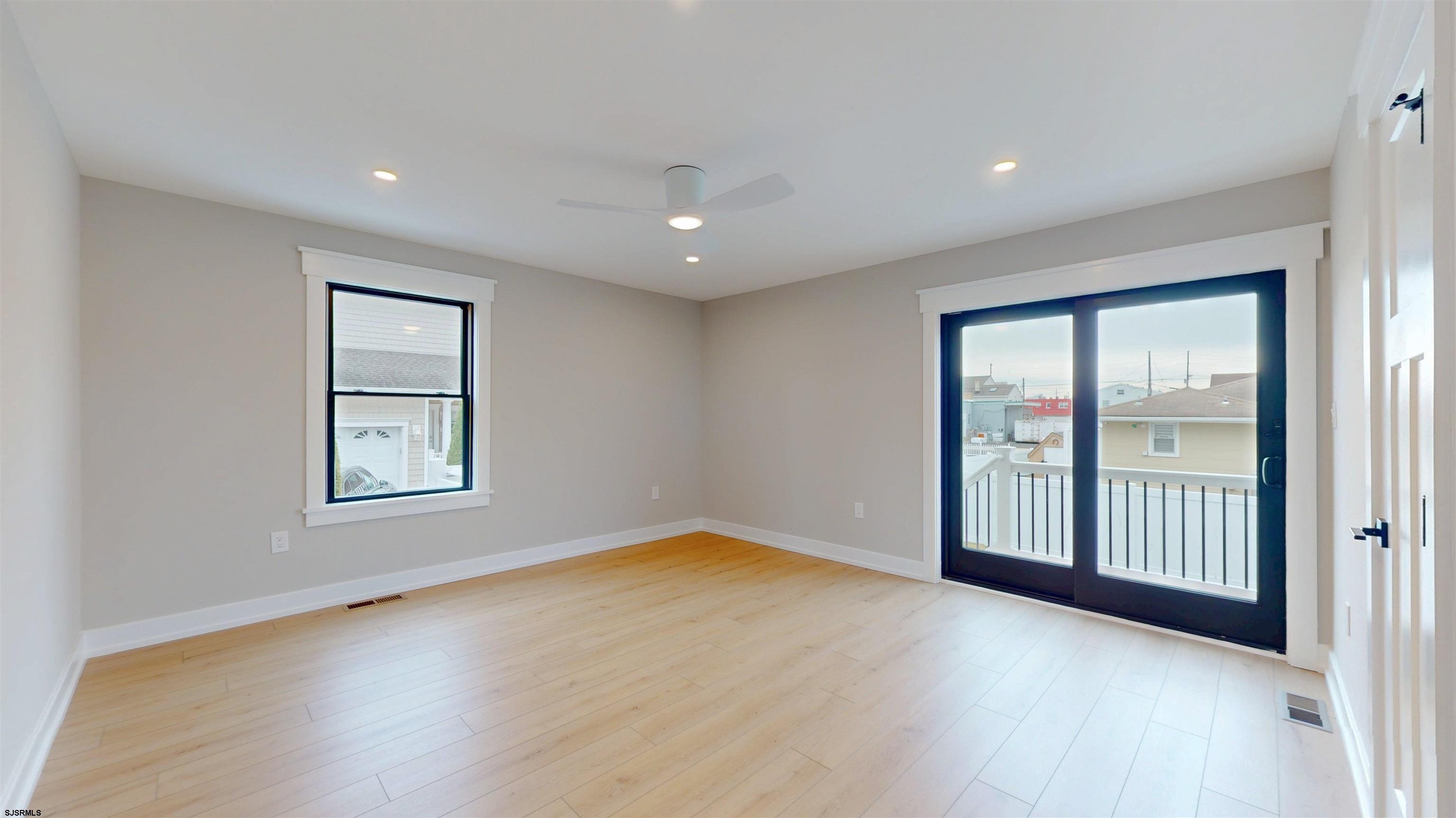 204 12th Street South Brigantine, NJ 08203 - Photo 50 of 63 an empty room with wooden floor and windows