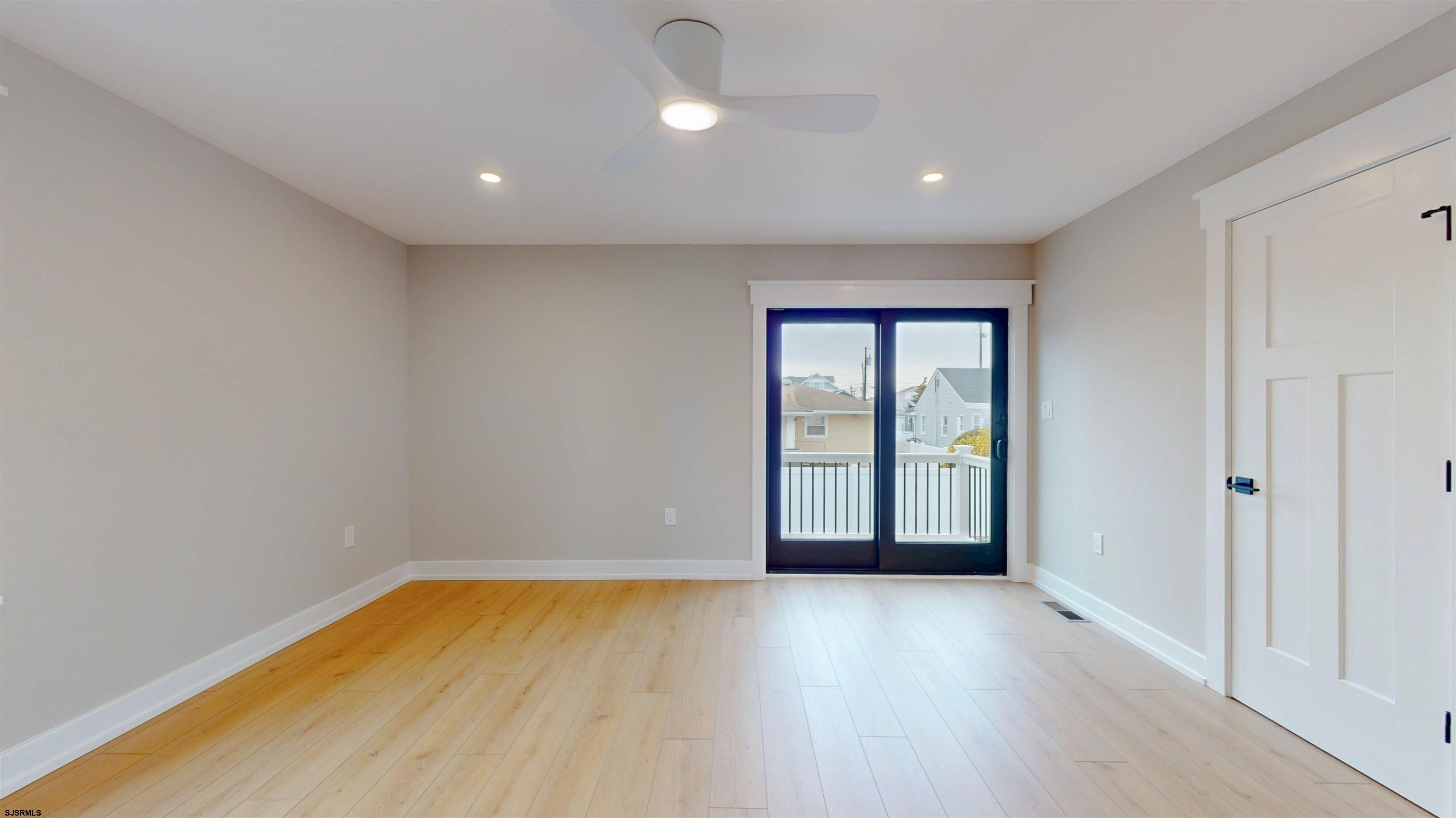 204 12th Street South Brigantine, NJ 08203 - Photo 51 of 63 a view of empty room with wooden floor and fan