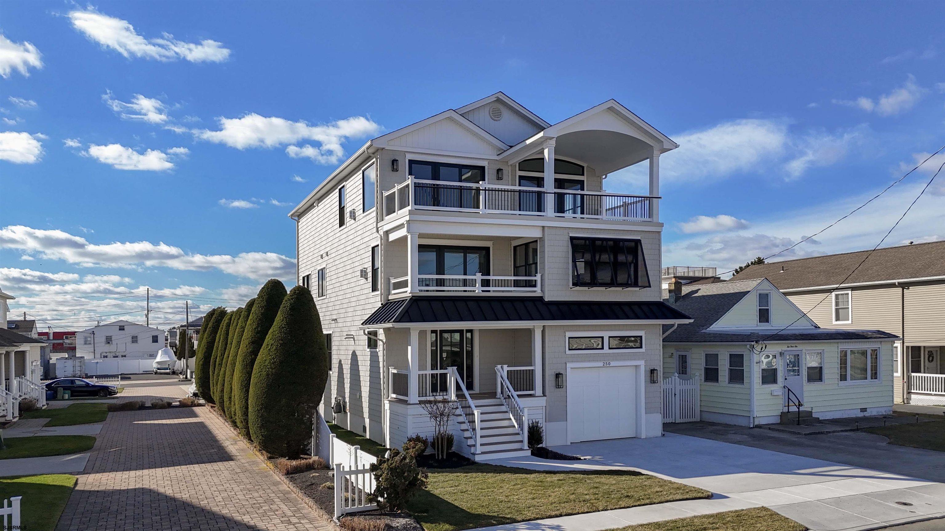 204 12th Street South Brigantine, NJ 08203 - Photo 59 of 63 a front view of a house with a yard