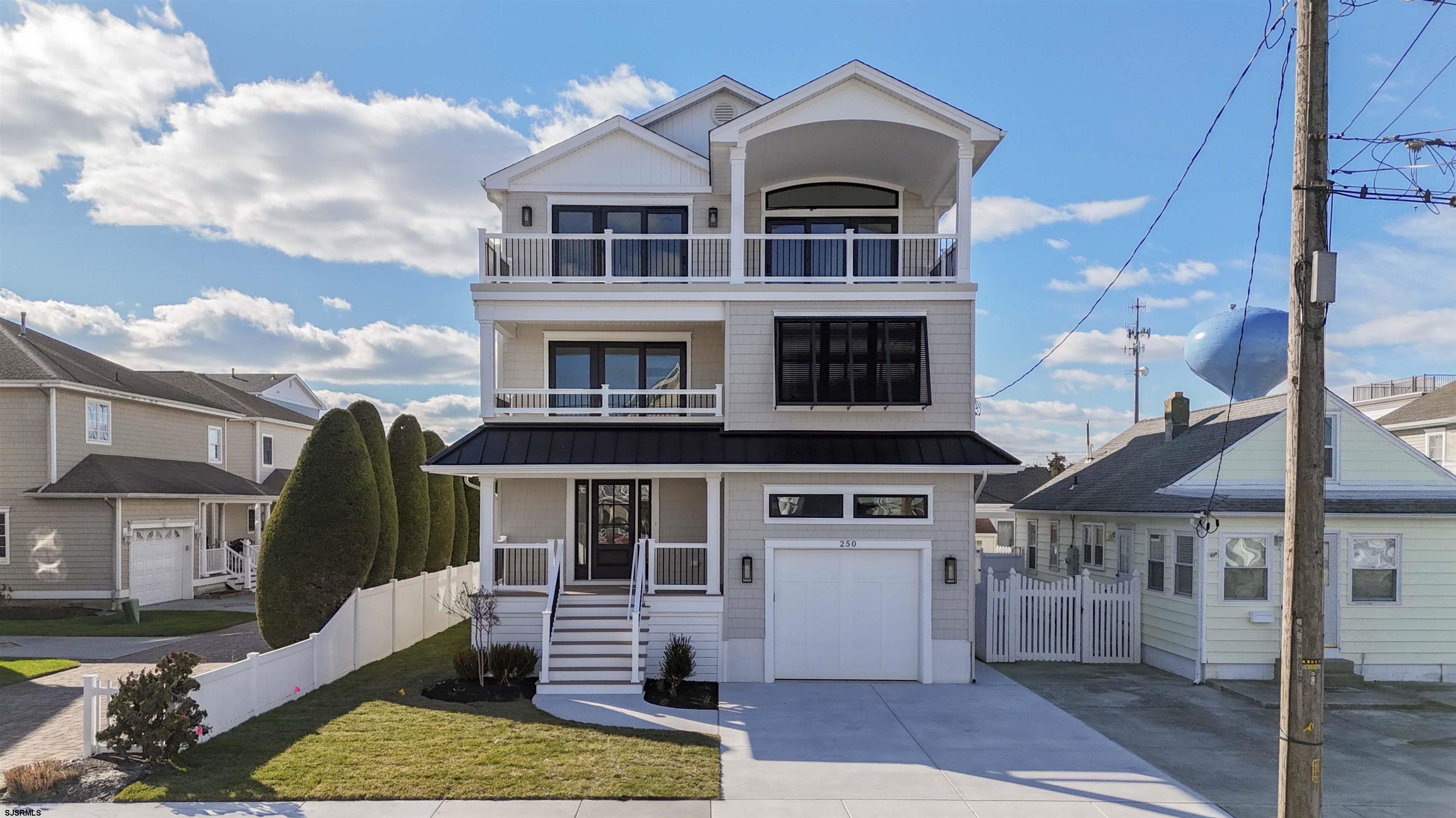 204 12th Street South Brigantine, NJ 08203 - Photo 60 of 63 a front view of a house with a yard