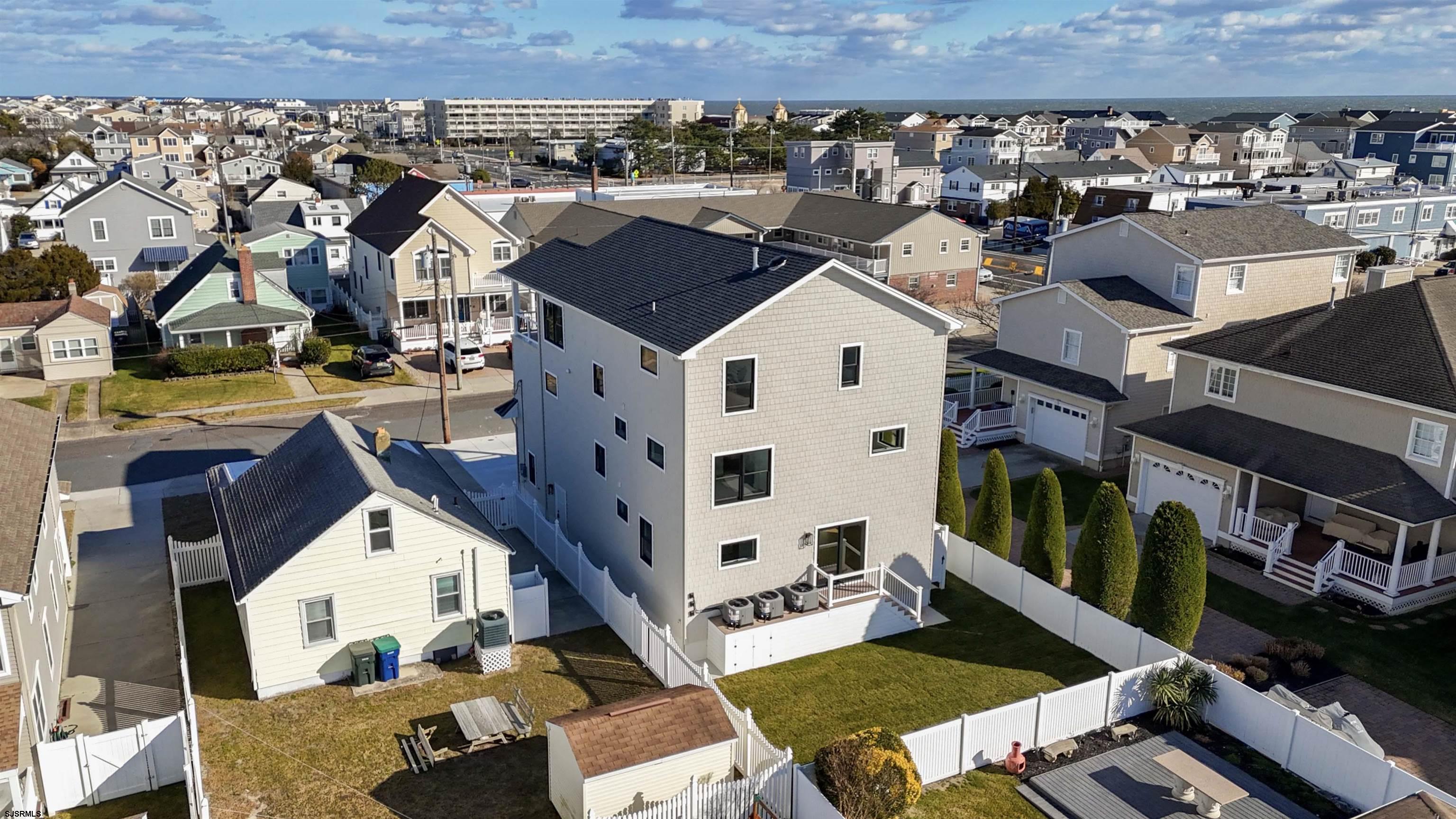 204 12th Street South Brigantine, NJ 08203 - Photo 61 of 63 an aerial view of a house with a yard