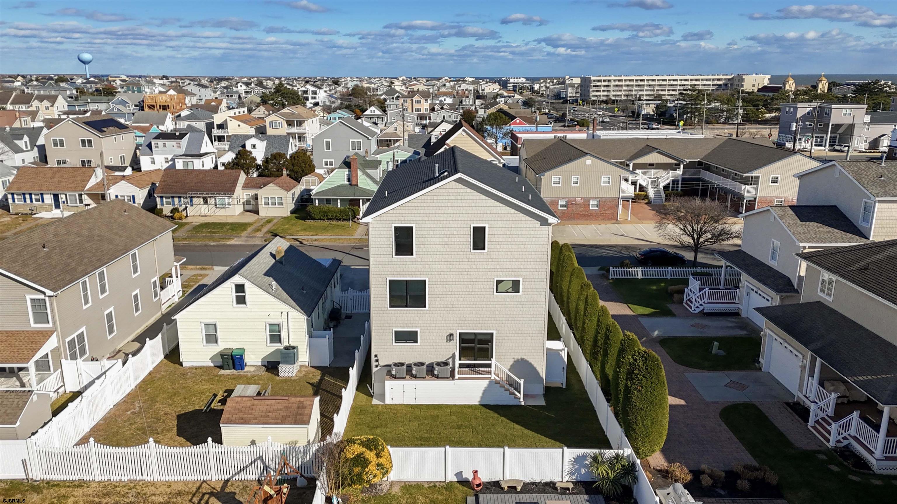 204 12th Street South Brigantine, NJ 08203 - Photo 63 of 63 an aerial view of a house with a swimming pool