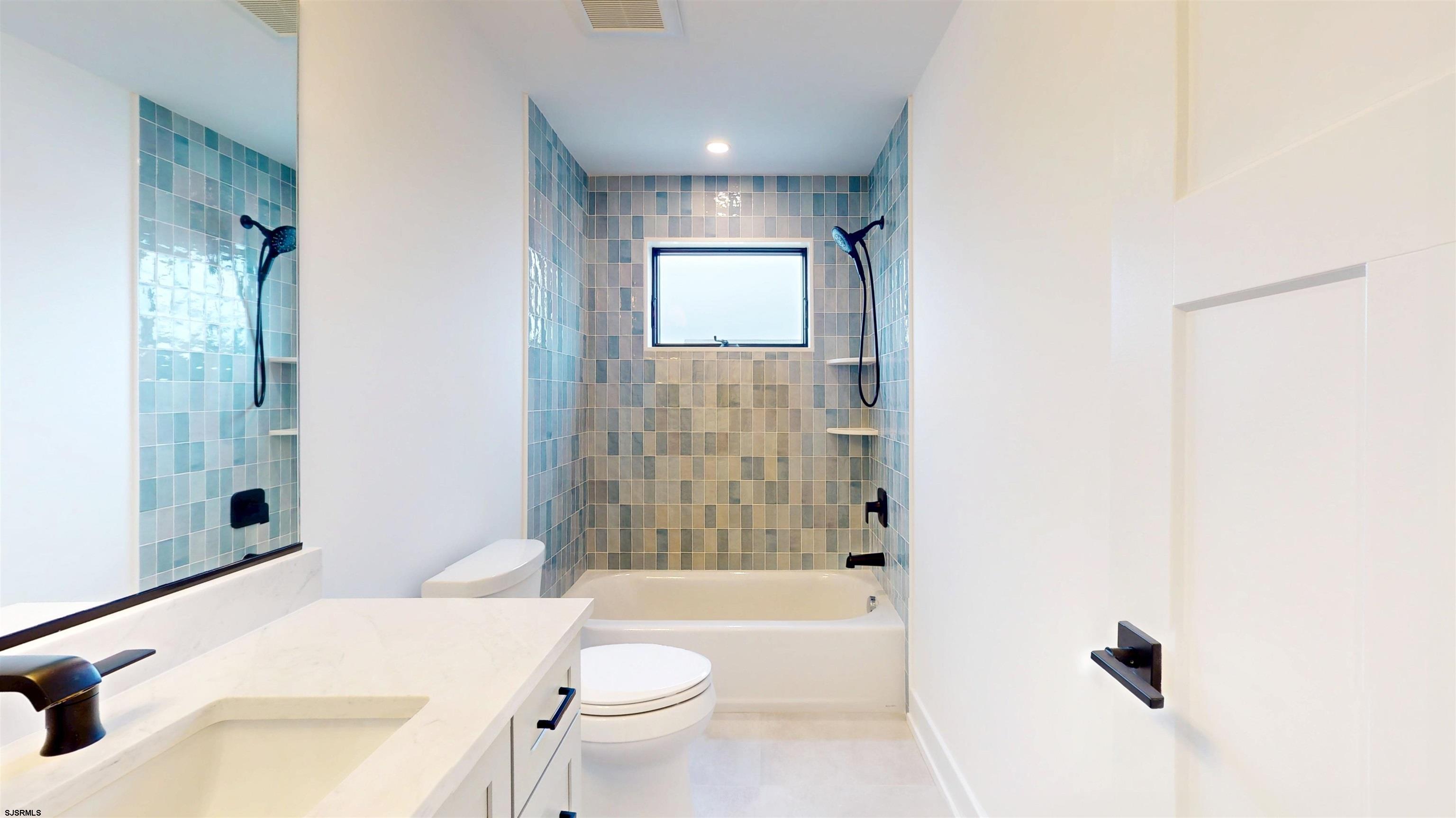 204 12th Street South Brigantine, NJ 08203 - Photo 9 of 63 a bathroom with a sink toilet tub and shower