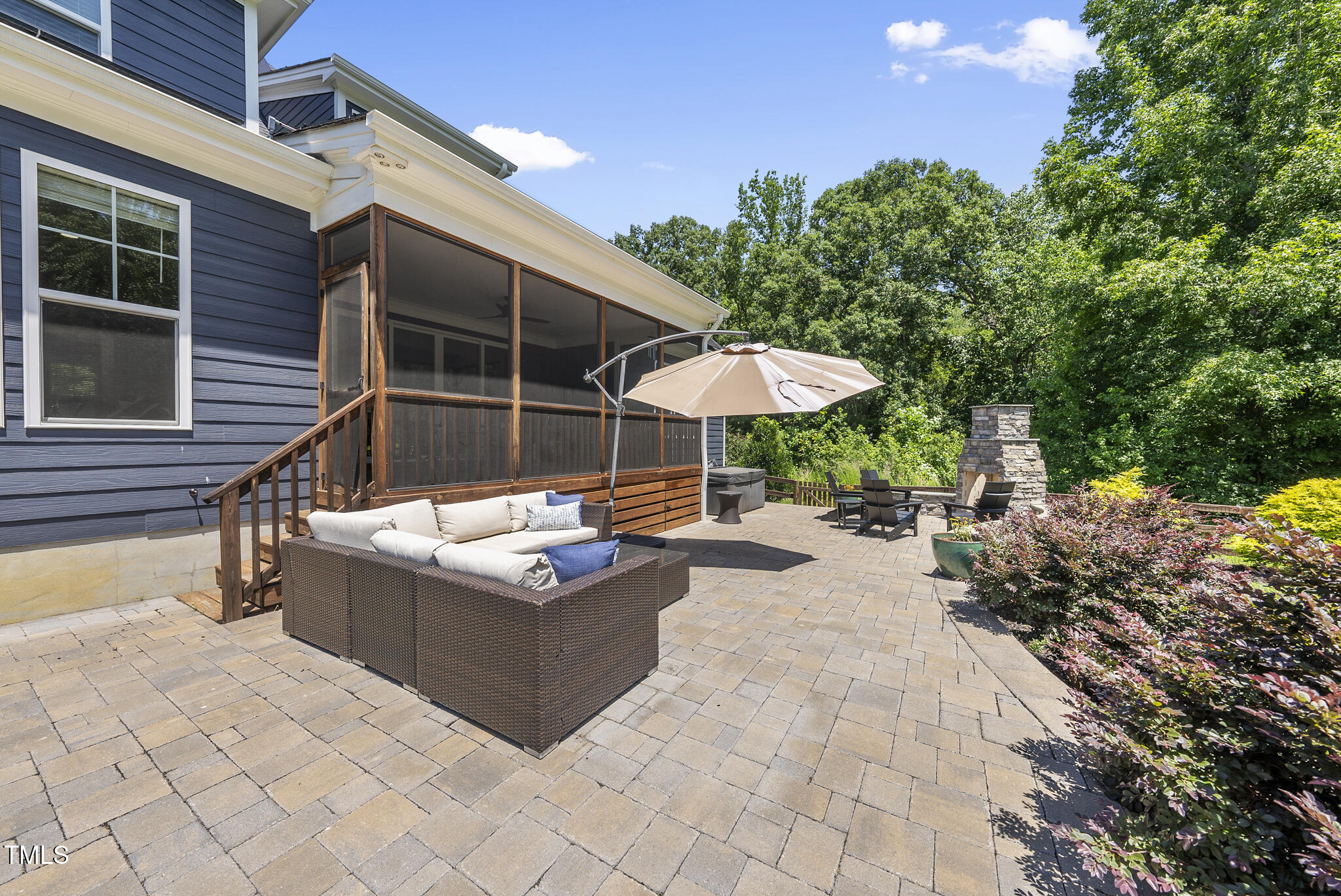 2416 Eddie Howard Road Willow Spring, NC 27592 - Photo 13 of 64 a view of a patio with chairs and a table