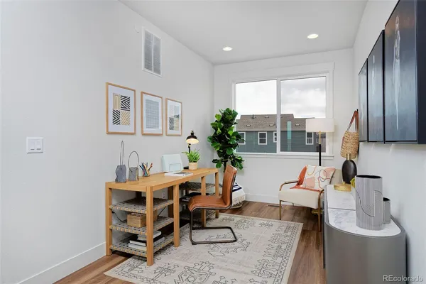 a dining room with furniture and window