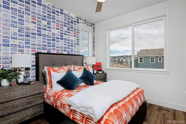 a bedroom with a bed and a couch