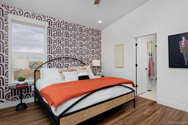 a bedroom with a bed and a dresser