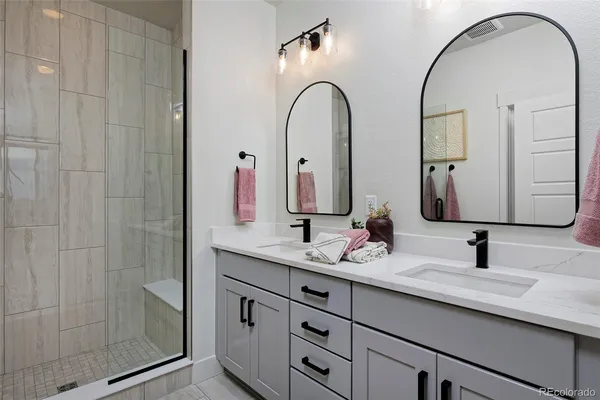 a bathroom with a shower and a sink