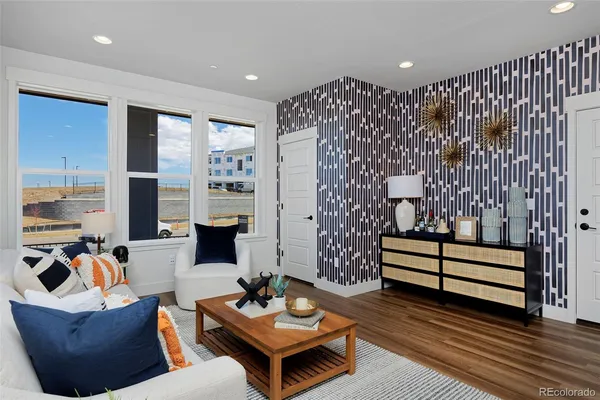 a living room with furniture and a large window