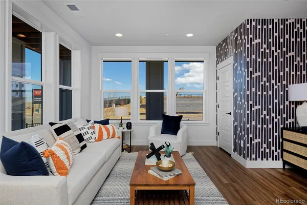a living room with furniture and a large window