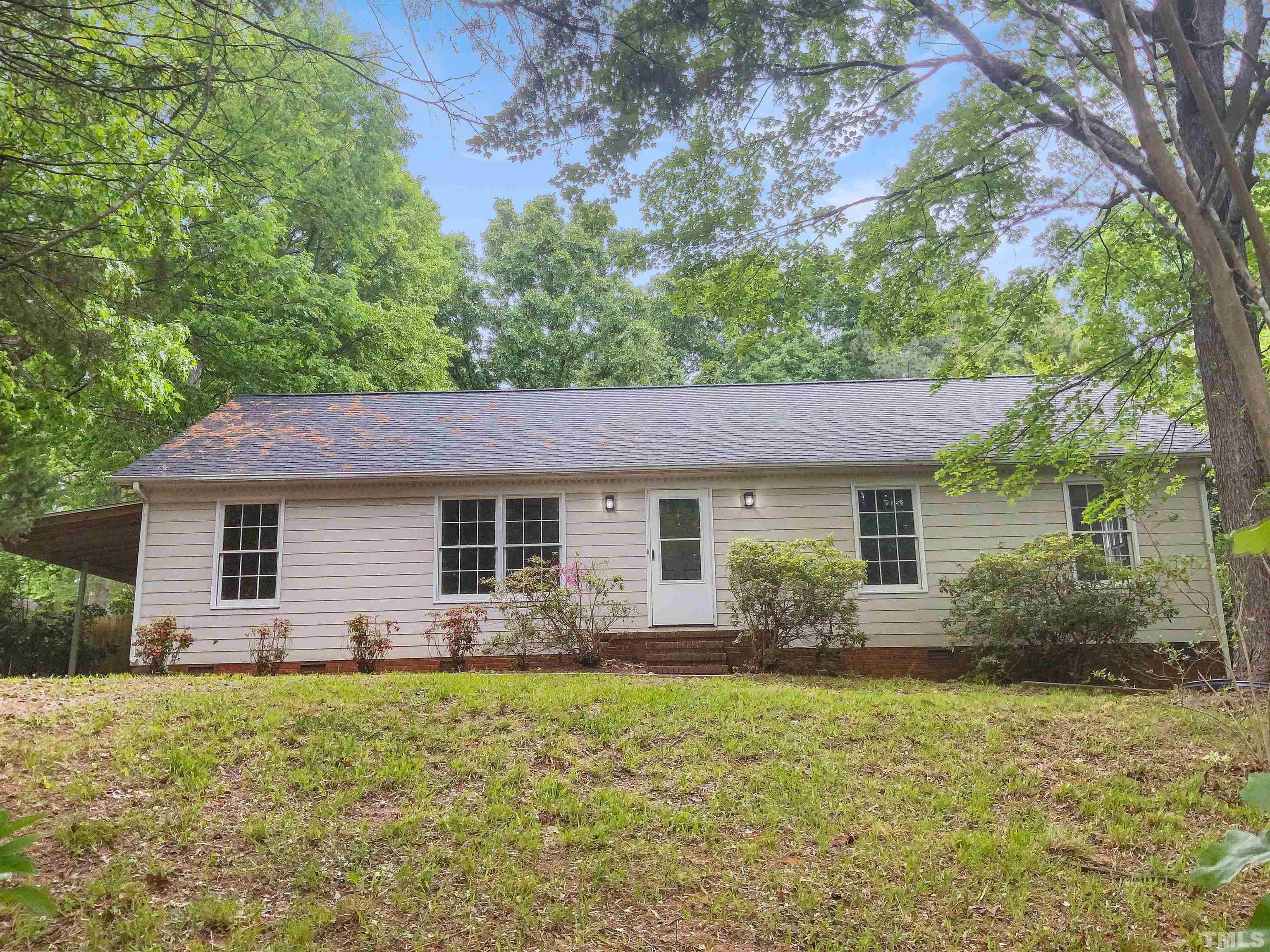 7312 Mine Valley Road Raleigh, NC 27615 - Photo 1 of 19 a front view of house with yard and green space