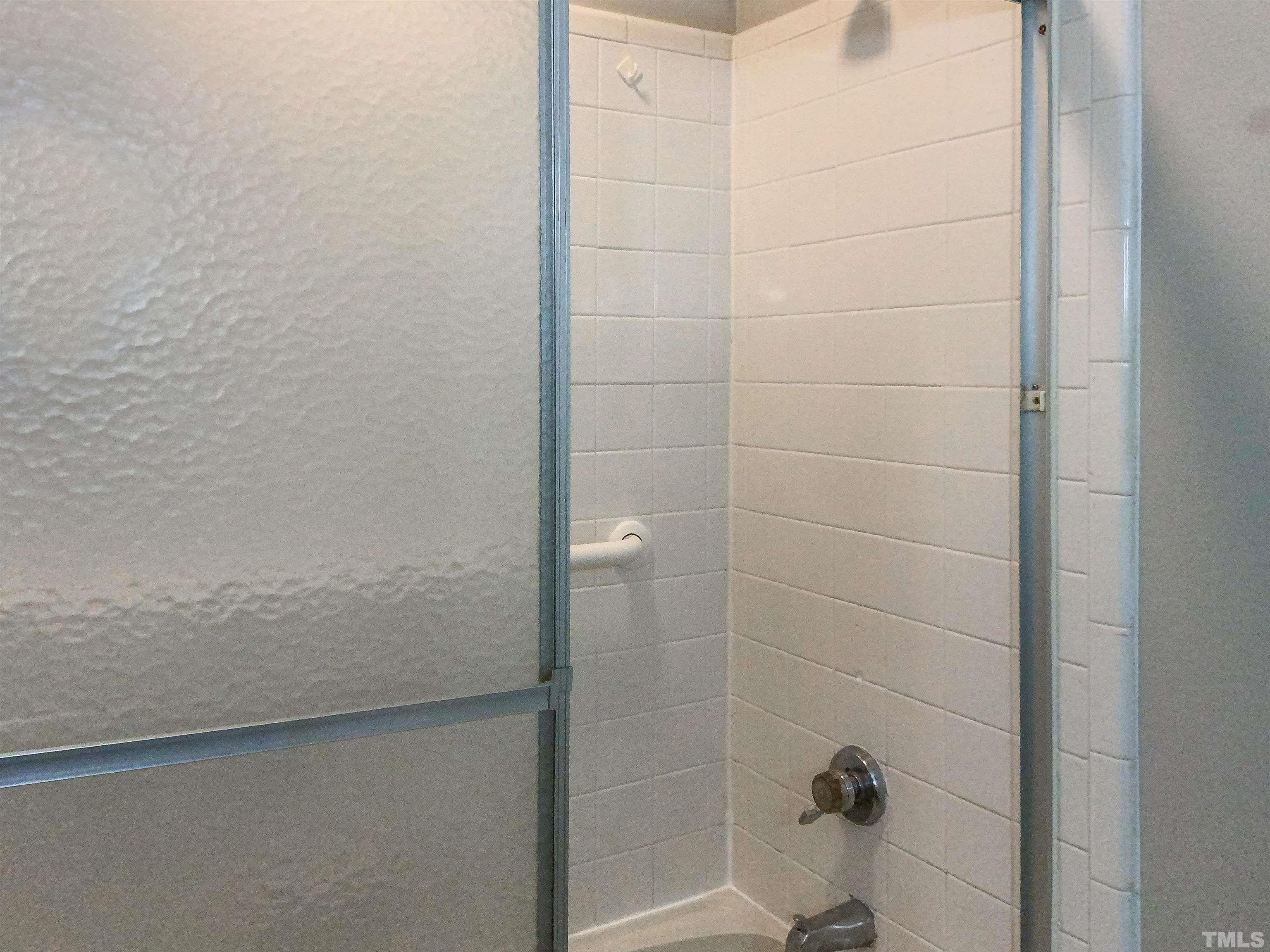 7312 Mine Valley Road Raleigh, NC 27615 - Photo 14 of 19 a bathroom with a shower