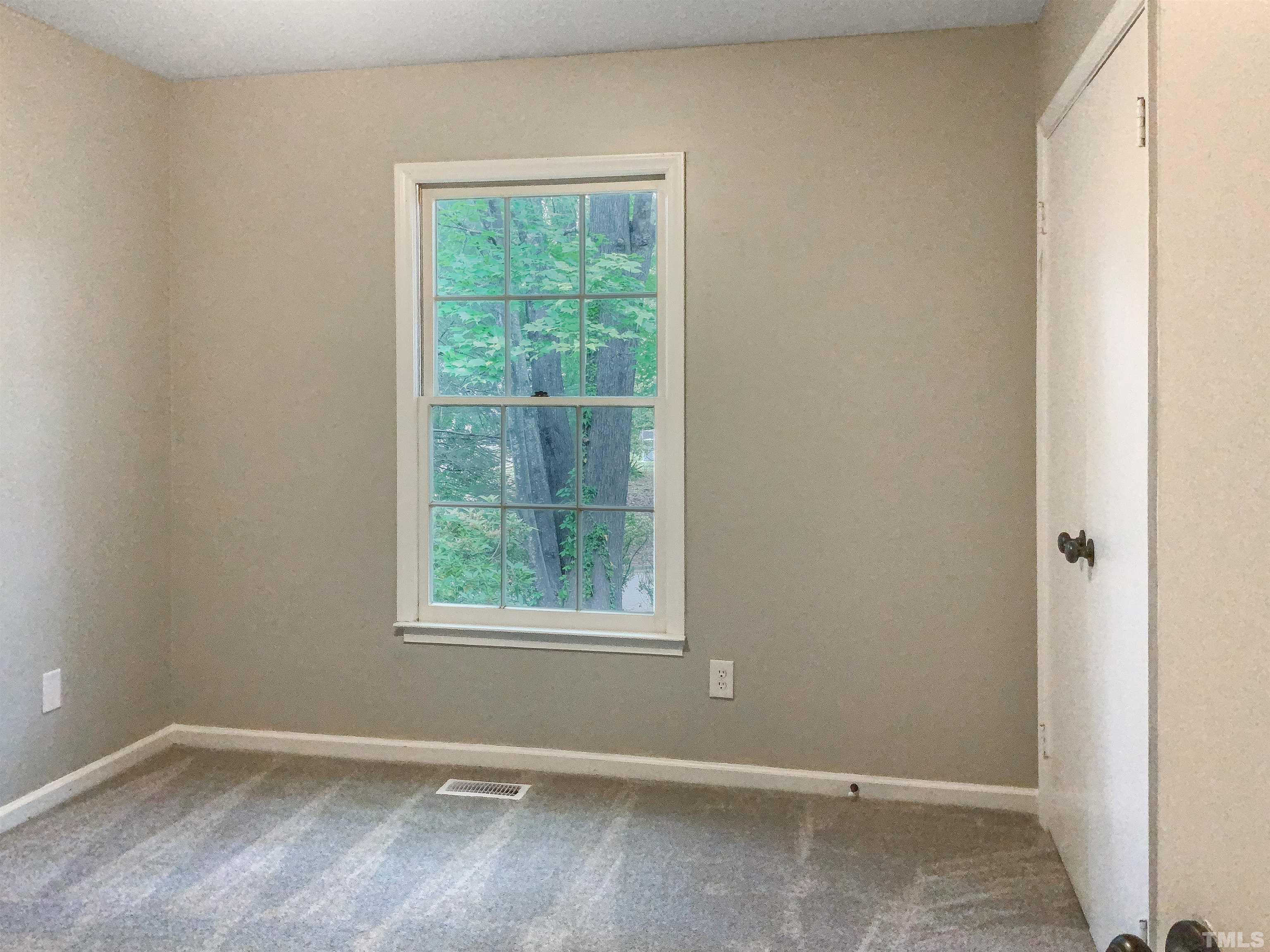 7312 Mine Valley Road Raleigh, NC 27615 - Photo 15 of 19 an empty room with a window