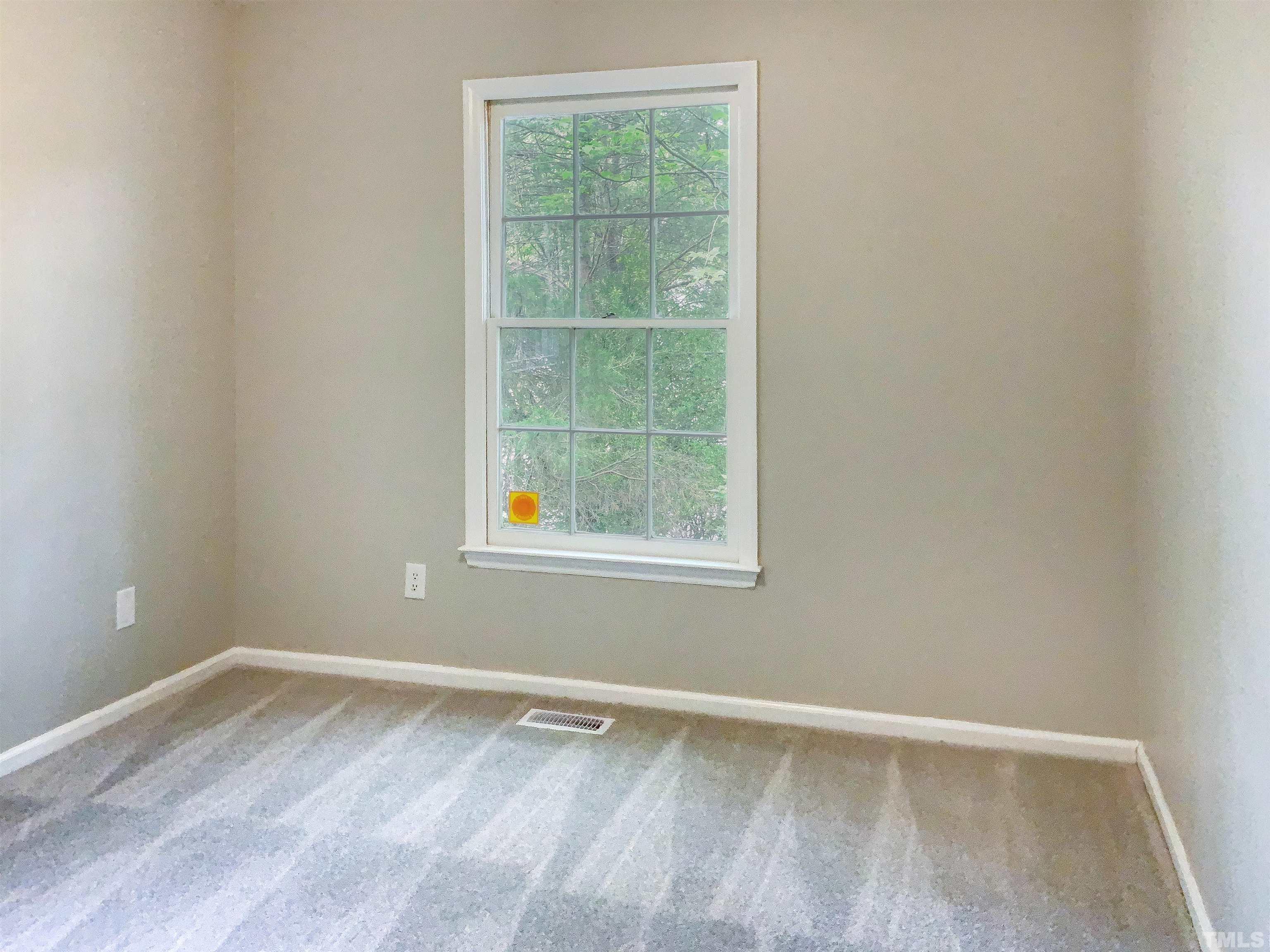 7312 Mine Valley Road Raleigh, NC 27615 - Photo 16 of 19 an empty room with a window