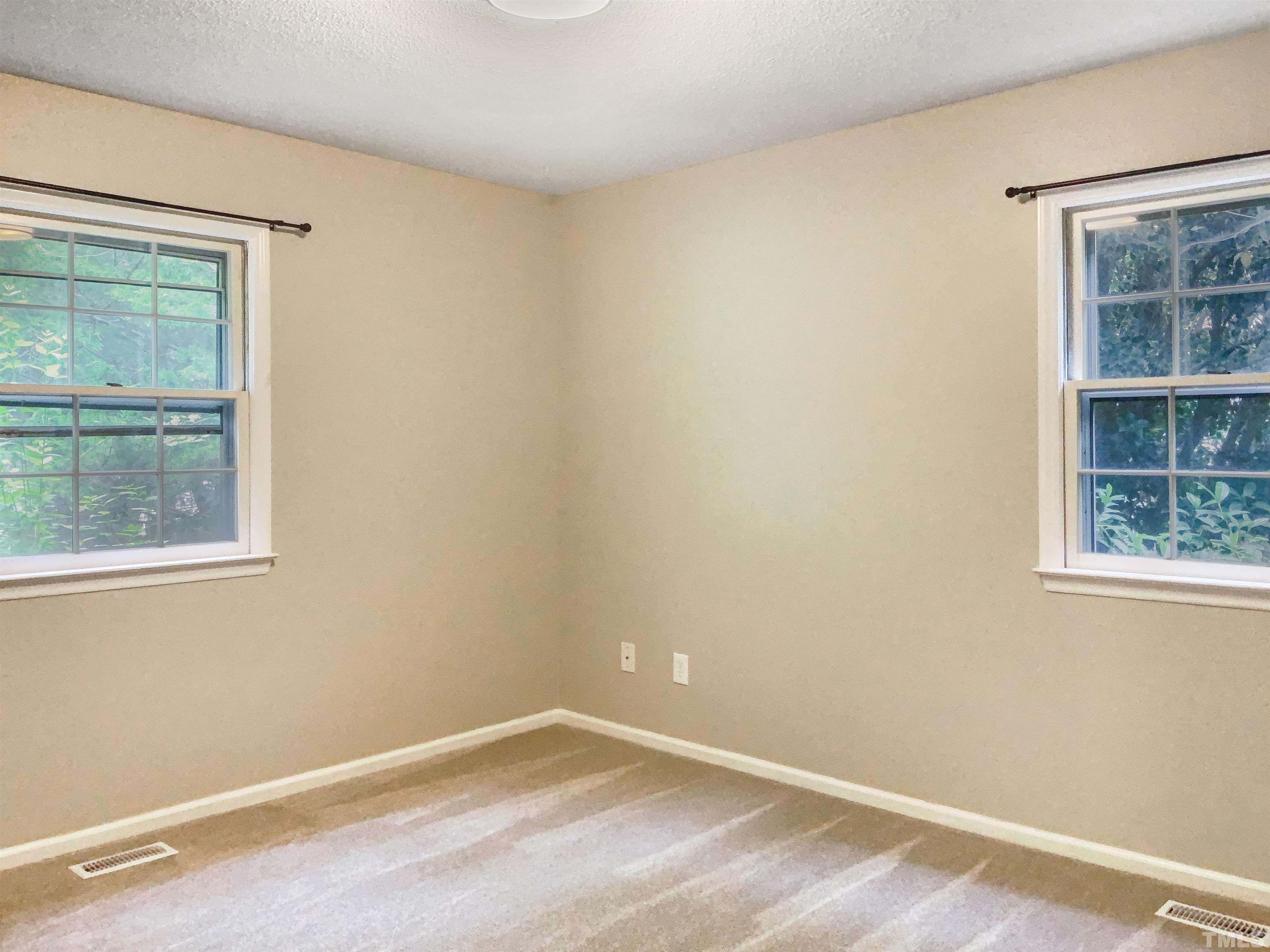7312 Mine Valley Road Raleigh, NC 27615 - Photo 17 of 19 an empty room with a window