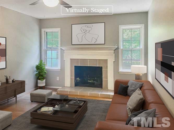 7312 Mine Valley Road Raleigh, NC 27615 - Photo 2 of 19 a living room with furniture fireplace and window