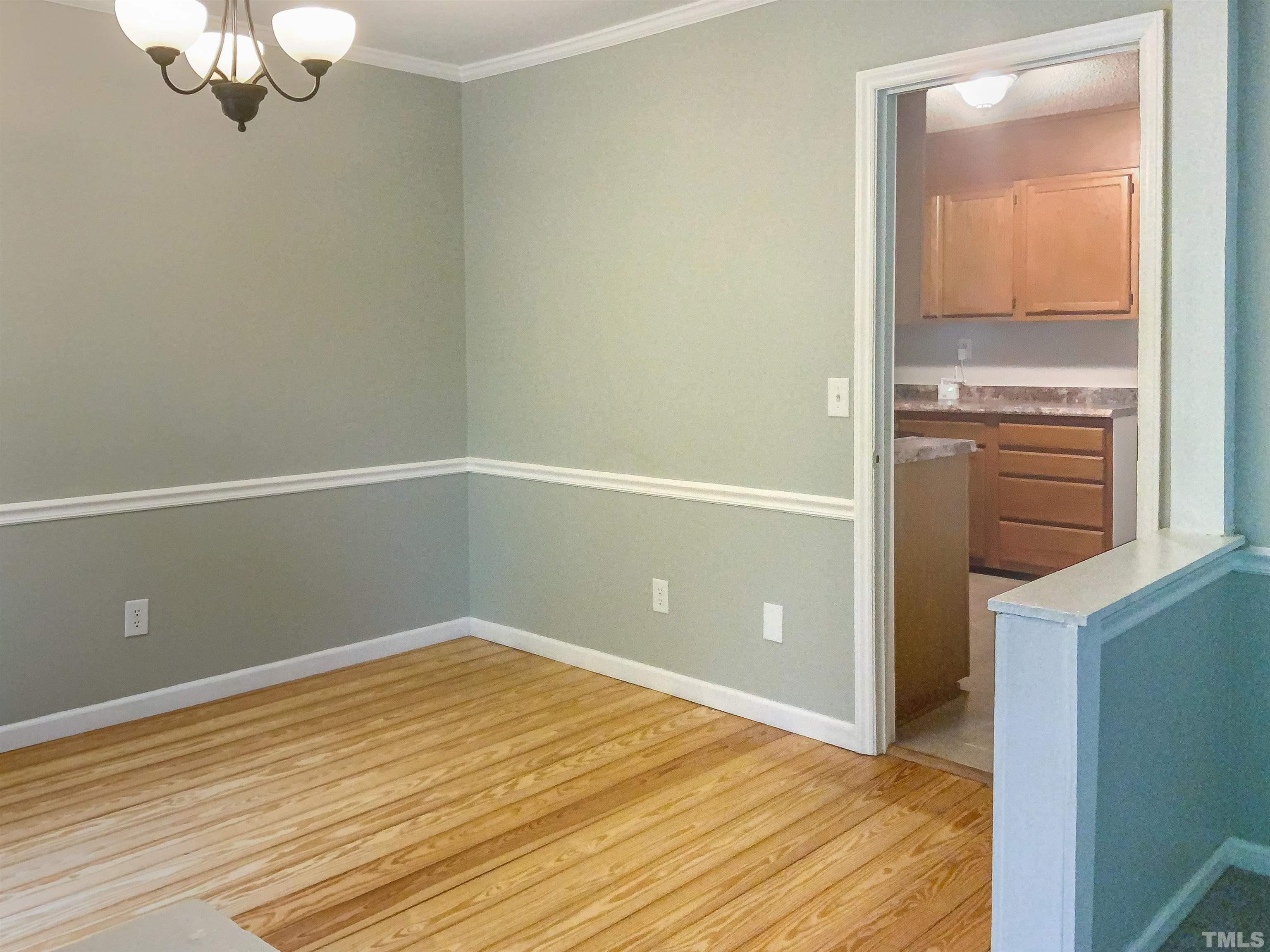 7312 Mine Valley Road Raleigh, NC 27615 - Photo 9 of 19 a view of empty room with wooden floor