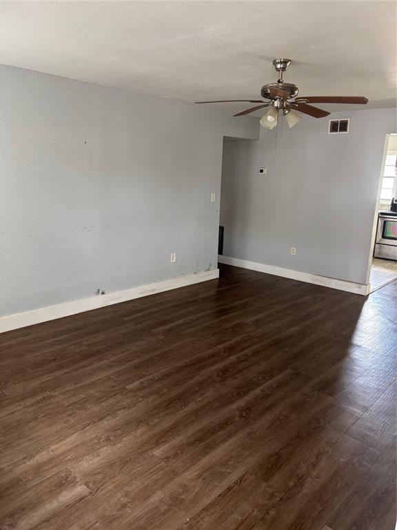 2779 L B McLeod Road, Unit A Orlando, FL 32805 - Photo 2 of 8 a view of an empty room with wooden floor