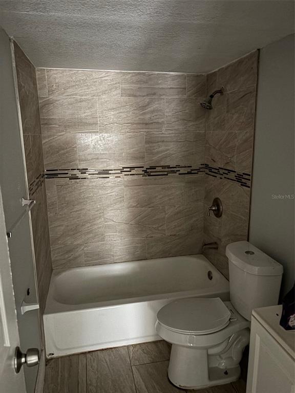 2779 L B McLeod Road, Unit A Orlando, FL 32805 - Photo 8 of 8 a bathroom with a toilet and a shower