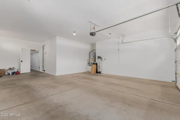 a view of a house with wooden fence