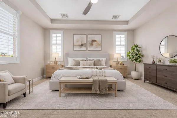 a bedroom with a large bed and a couch