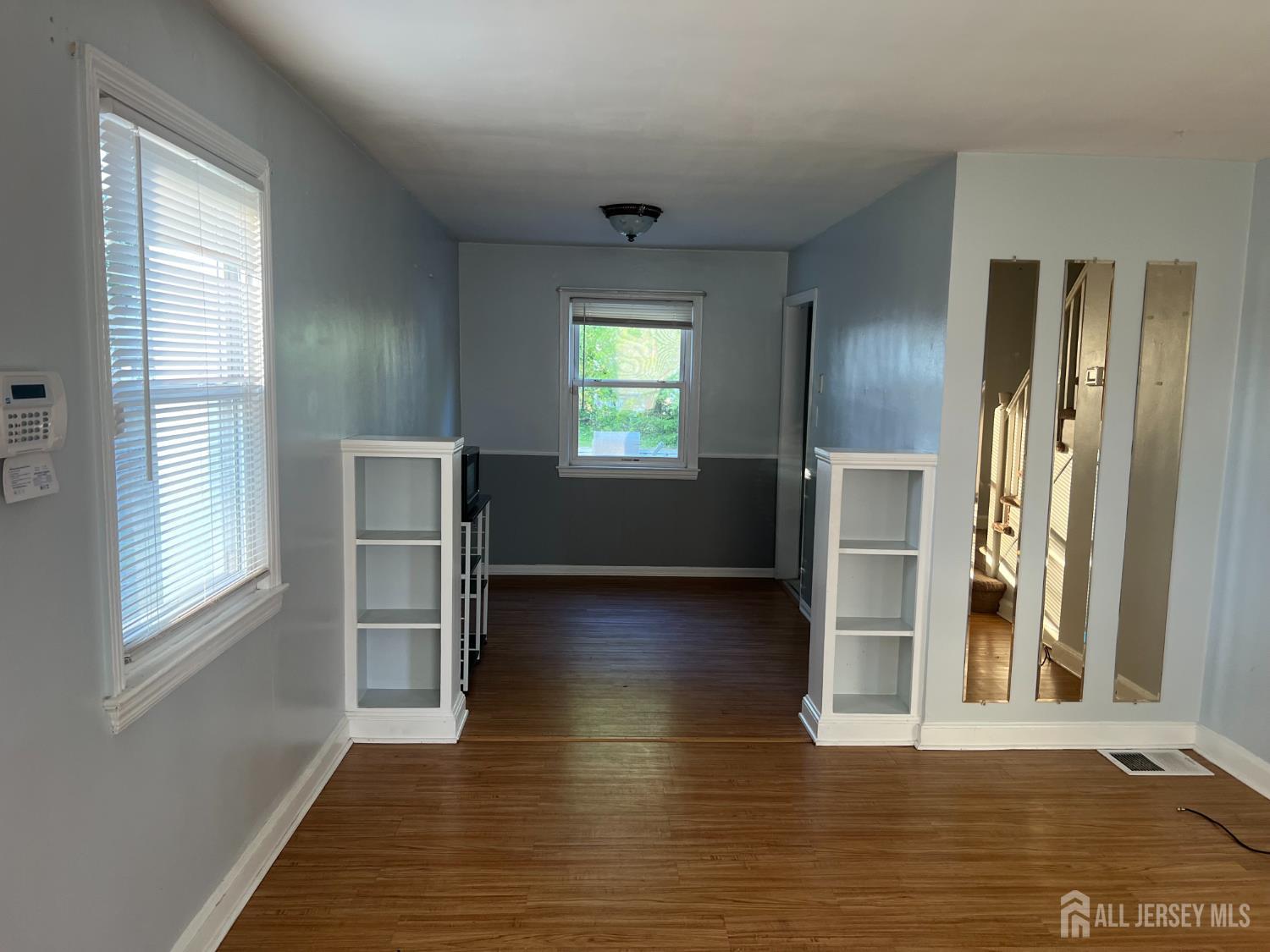 444 Crows Mill Road Fords, NJ 08863 - Photo 3 of 3 a view of empty room with wooden floor and fan