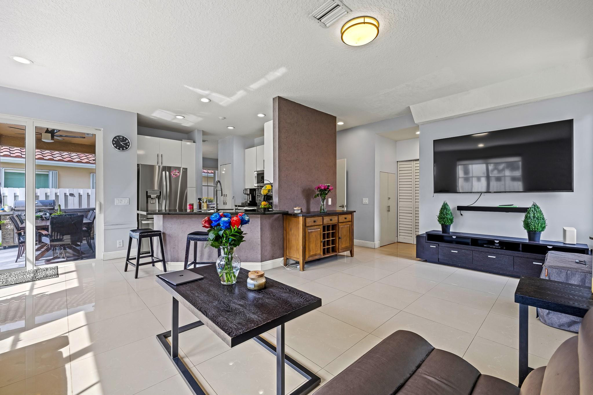 695 Falling Water Road Weston, FL 33326 - Photo 11 of 31 a living room with furniture and kitchen view