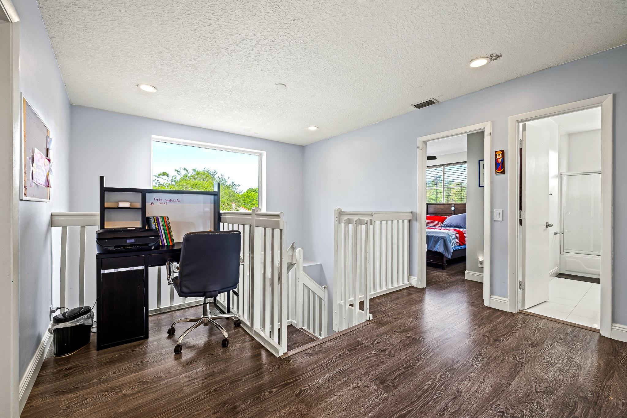 695 Falling Water Road Weston, FL 33326 - Photo 13 of 31 a view of a workspace with furniture and a window
