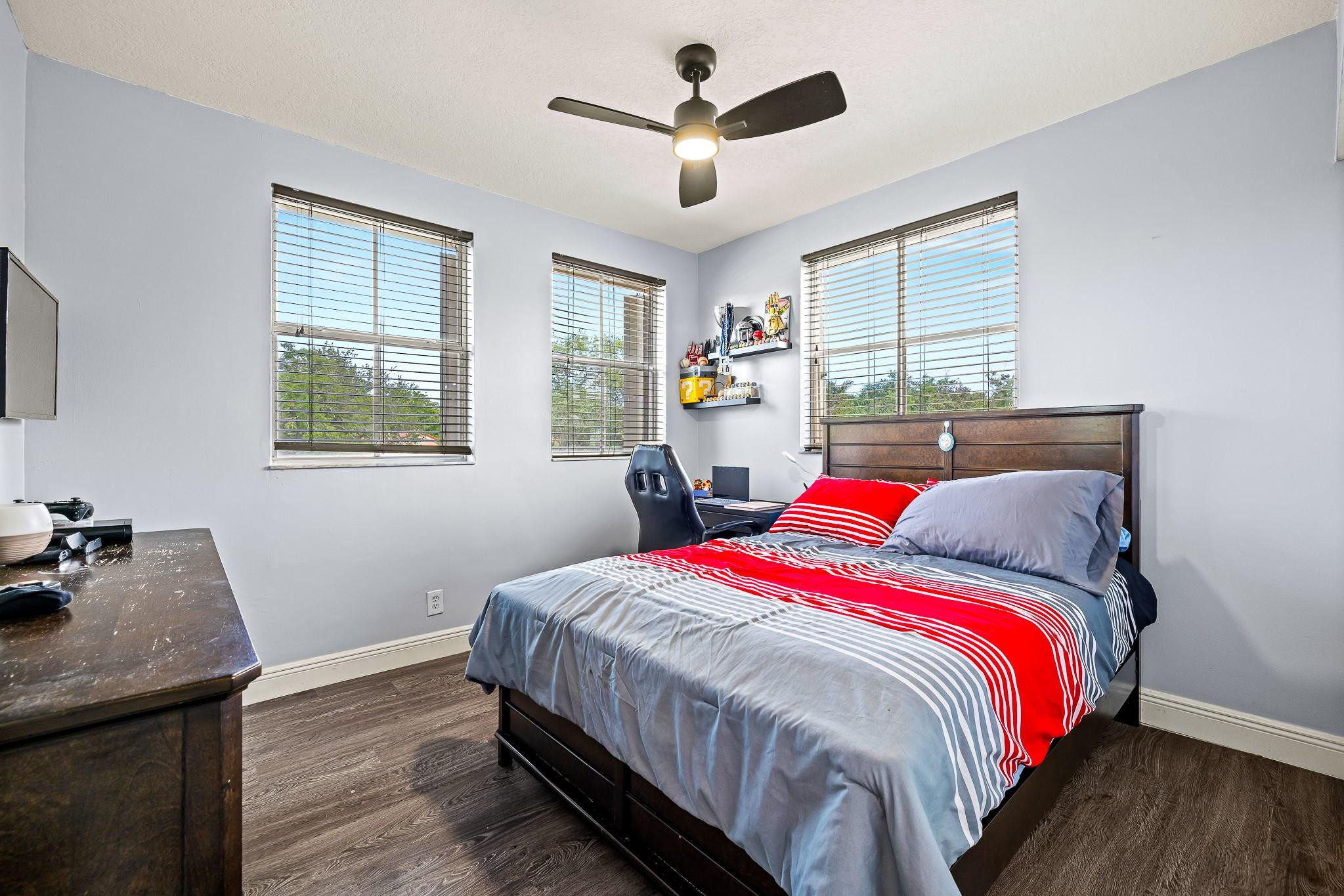 695 Falling Water Road Weston, FL 33326 - Photo 15 of 31 a bed sitting in a bedroom next to a window